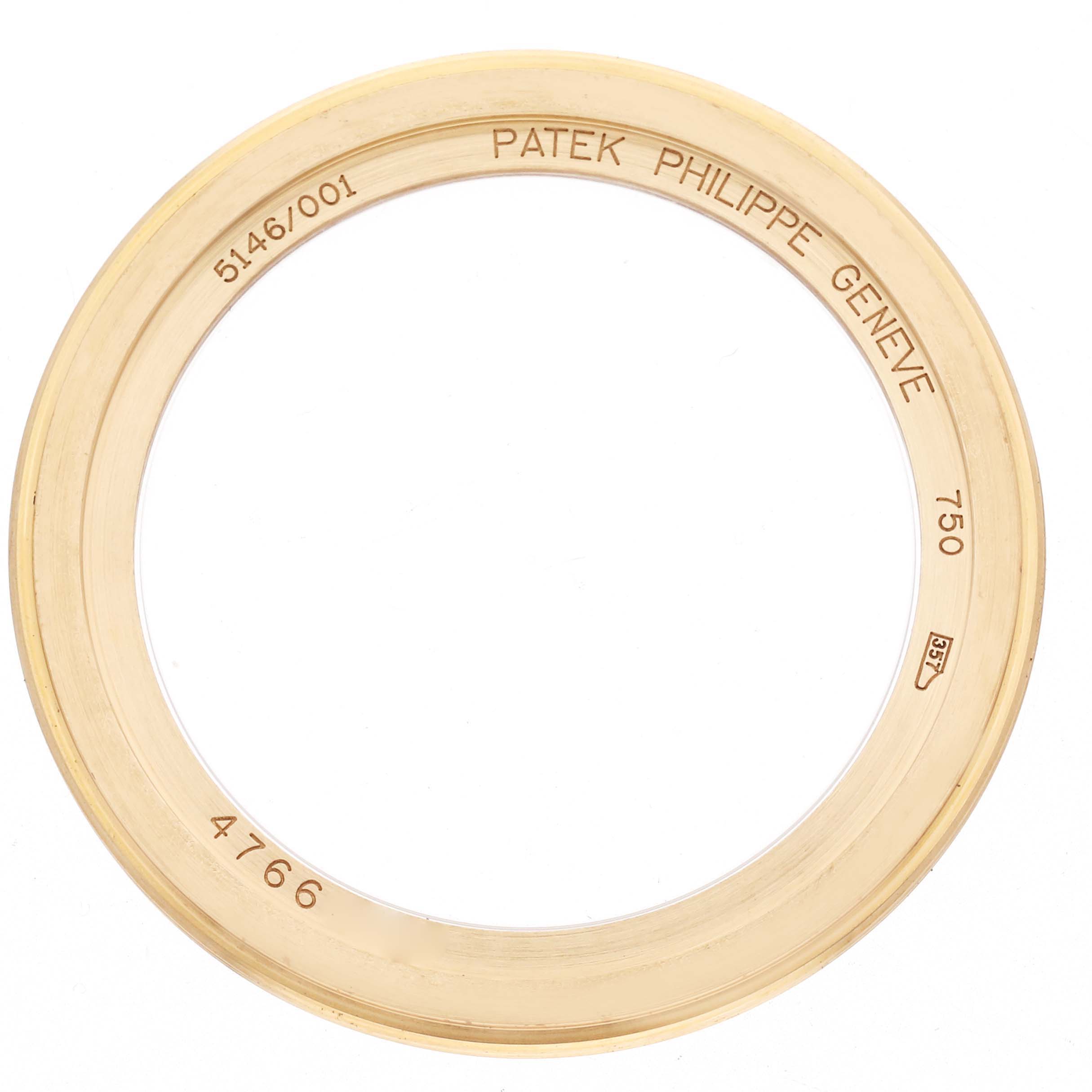 The image shows a gold bezel ring for a Patek Philippe Complications 5146J Men's Yellow Gold Beige Dial 5146J Men's Yellow Gold Beige Dial watch from a top-down angle, with engravings visible.