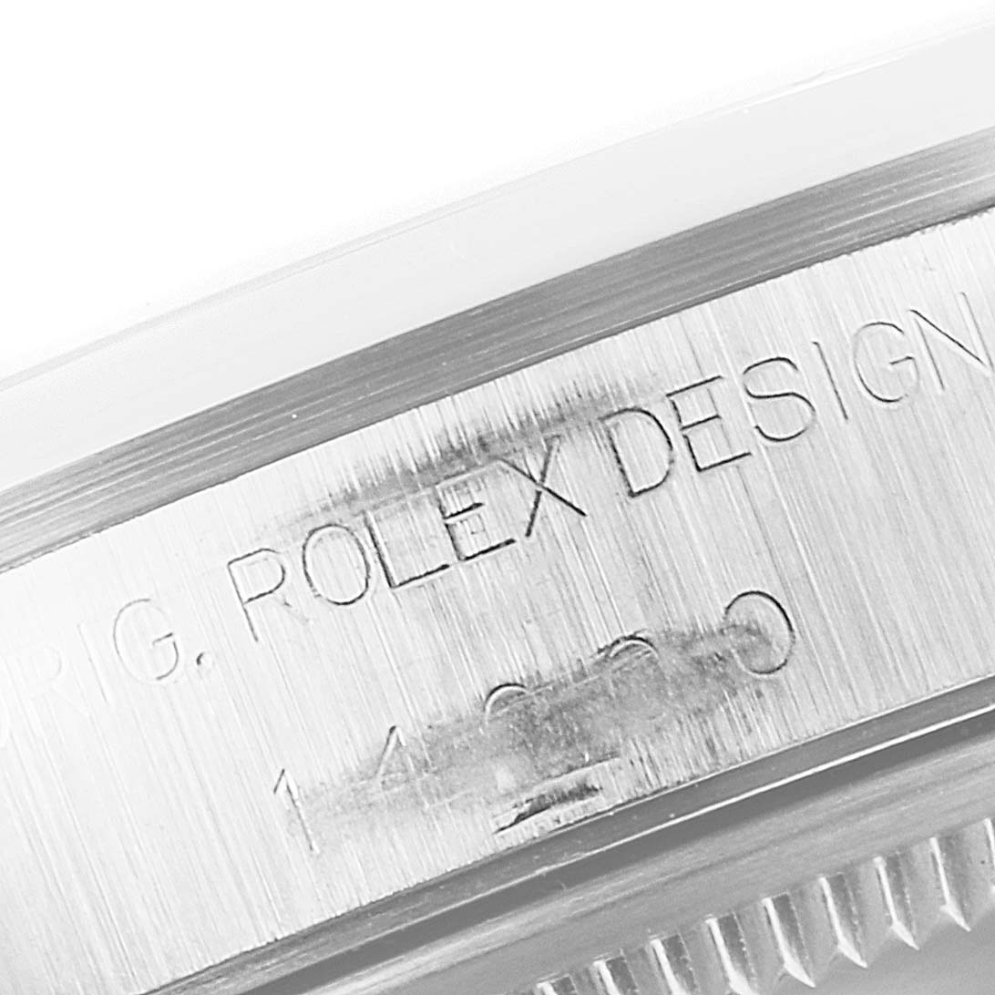 This close-up image of the Rolex Air-King 14000 Men's Stainless Steel Black Dial 14000 Men's Stainless Steel Black Dial shows the engraved design details on the side of the watch case.