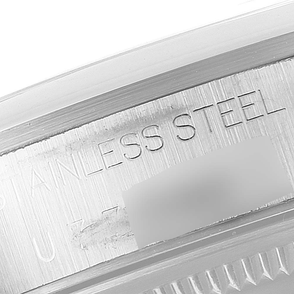 This image shows a close-up of the stainless steel casing of the Rolex Air-King 14000 Men's Stainless Steel Black Dial 14000 Men's Stainless Steel Black Dial watch.