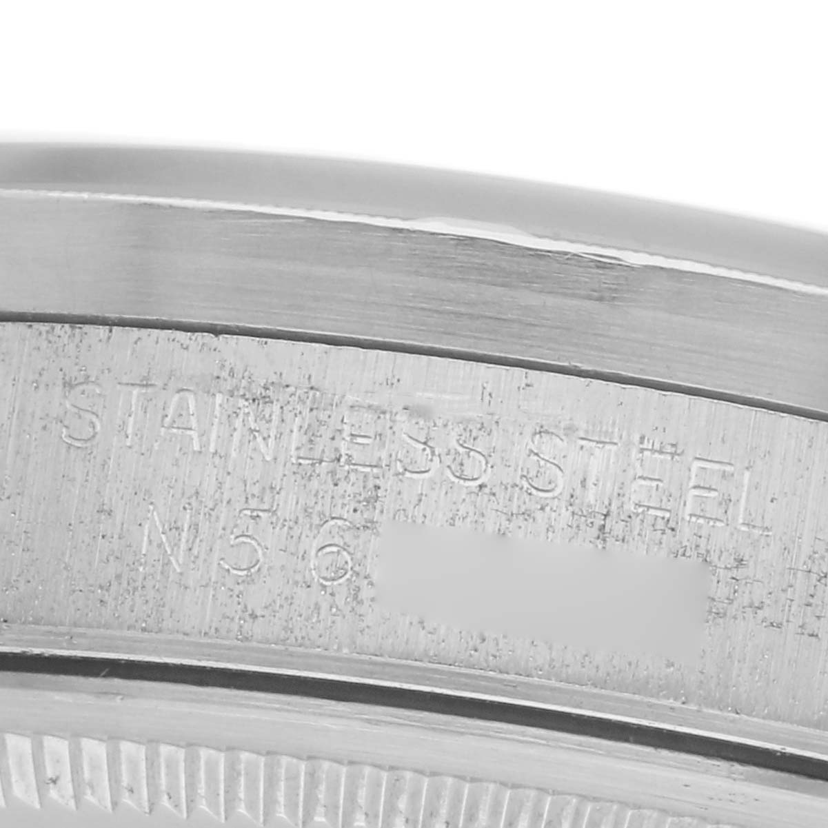 The image shows a detailed view of the case back edge with engravings on a Rolex Air-King 14010 Men's Stainless Steel Black Dial 14010 Men's Stainless Steel Black Dial watch.