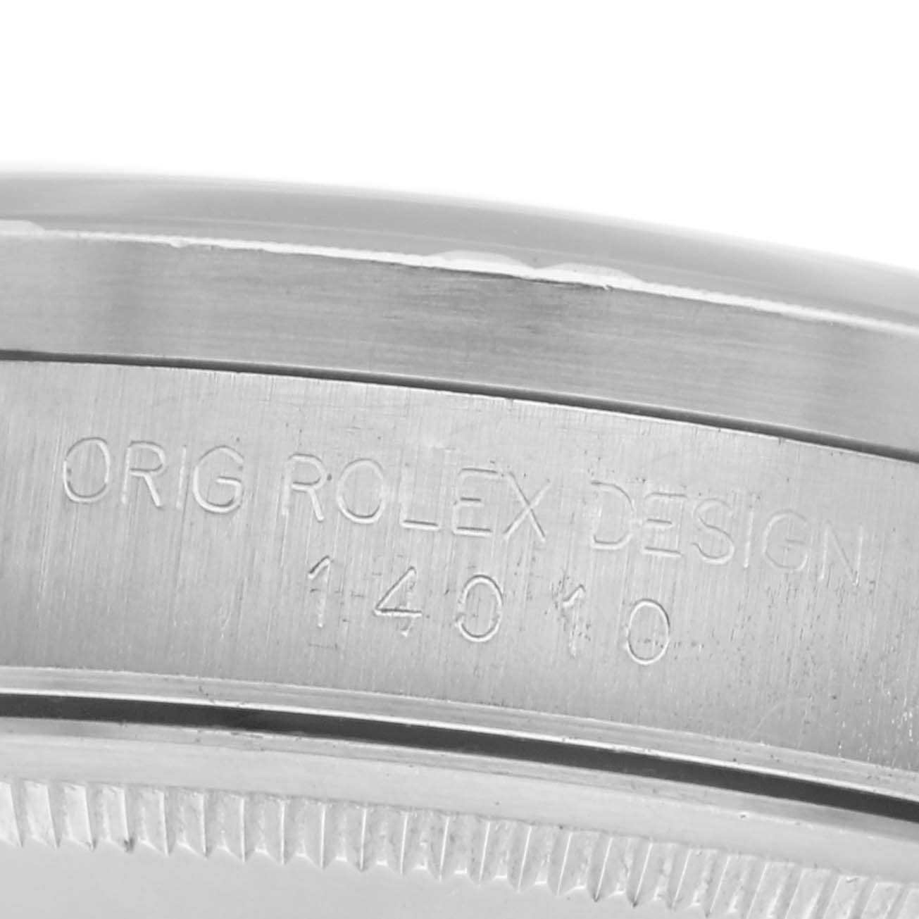 The image shows the side view of a Rolex Air-King 14010 Men's Stainless Steel Black Dial 14010 Men's Stainless Steel Black Dial watch, focusing on the engraved bezel with "ORIG ROLEX DESIGN 14010."