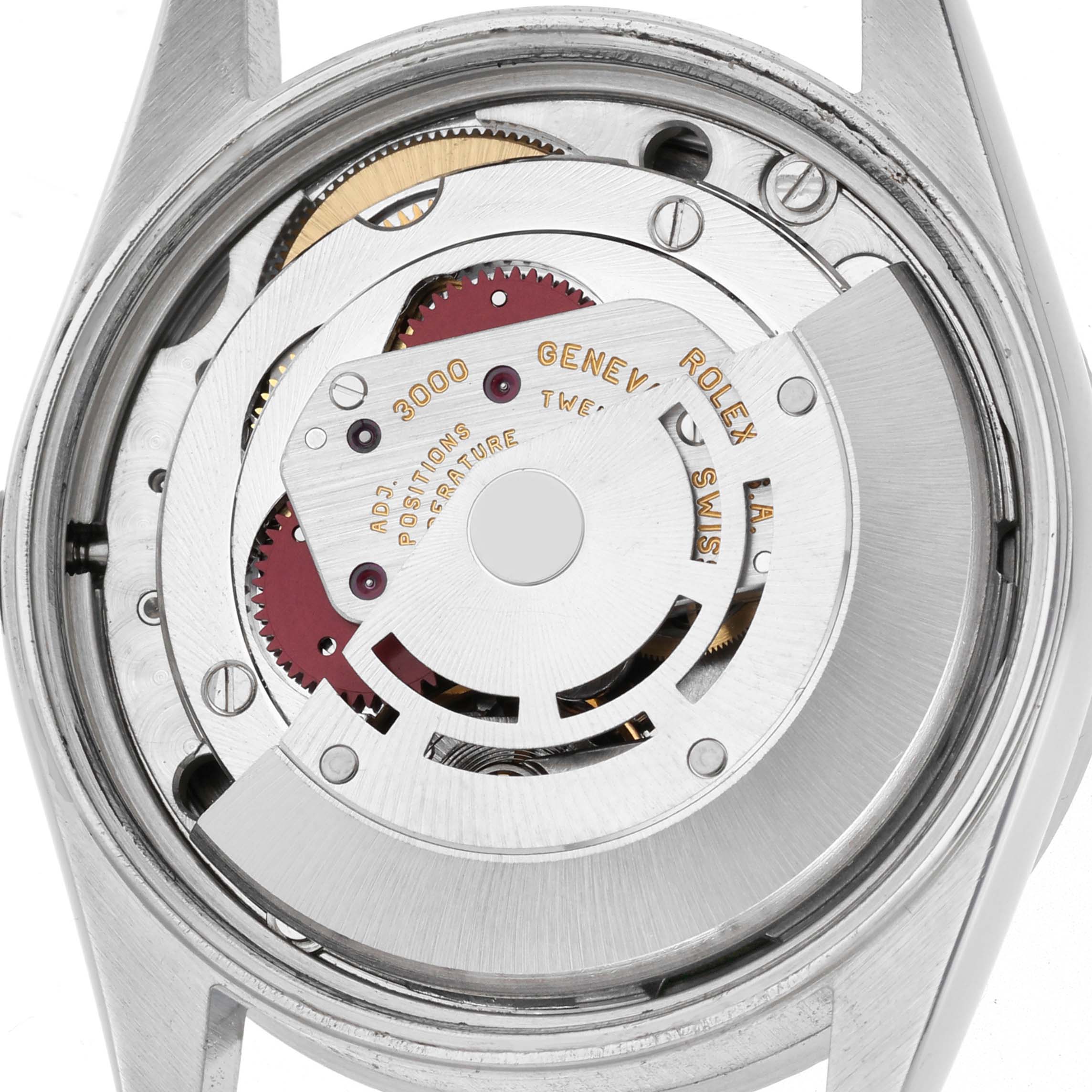 This image shows the Rolex Air-King 14010 Men's Stainless Steel Black Dial 14010 Men's Stainless Steel Black Dial watch movement, highlighting the rotor and internal components from a rear angle.