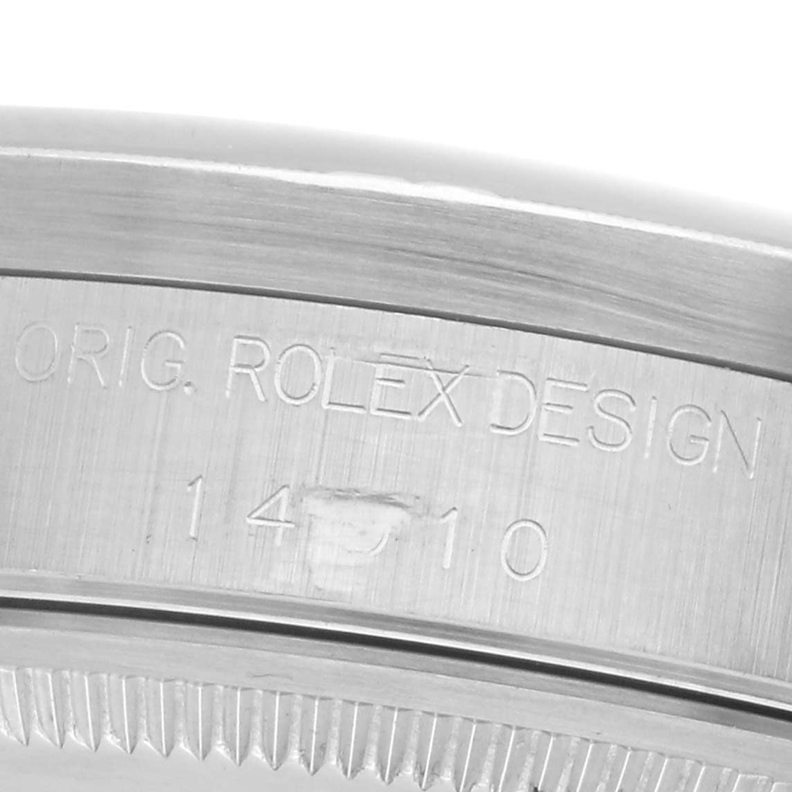 The image shows the side view of a Rolex Air-King 14010 Men's Stainless Steel Pink Dial 14010 Men's Stainless Steel Pink Dial, highlighting the engraved case back.