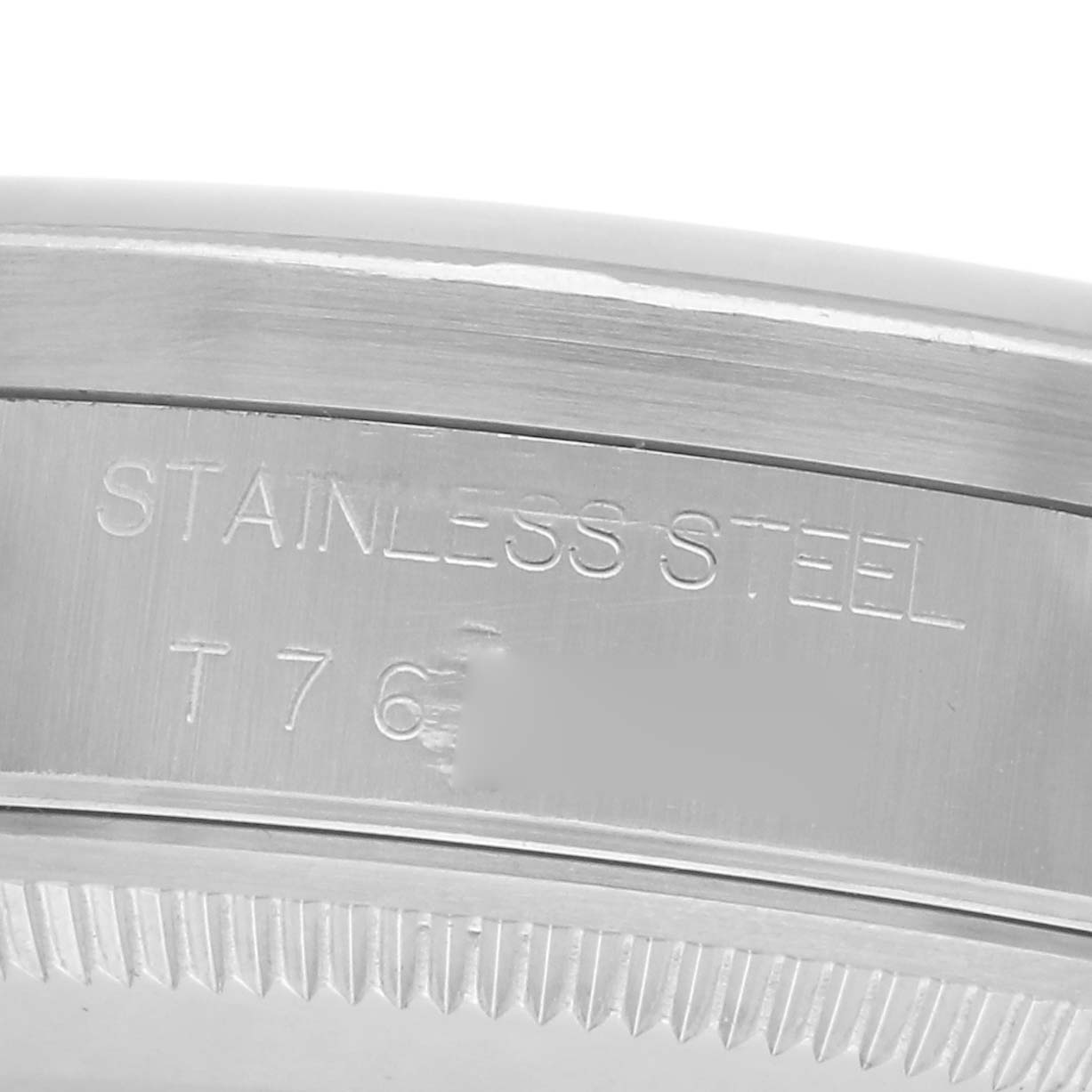 The image shows a close-up of the stainless steel back or edge of a Rolex Air-King 14010 Men's Stainless Steel Pink Dial 14010 Men's Stainless Steel Pink Dial watch, highlighting the engraved markings.