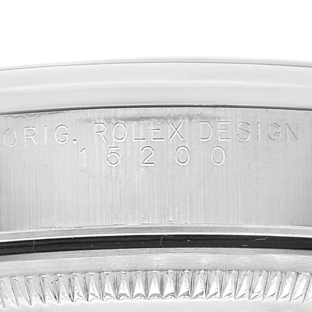 This close-up image shows the engraved model number "15200" on the case of the Rolex Date 15200 Men's Stainless Steel Black Dial 15200 Men's Stainless Steel Black Dial watch.