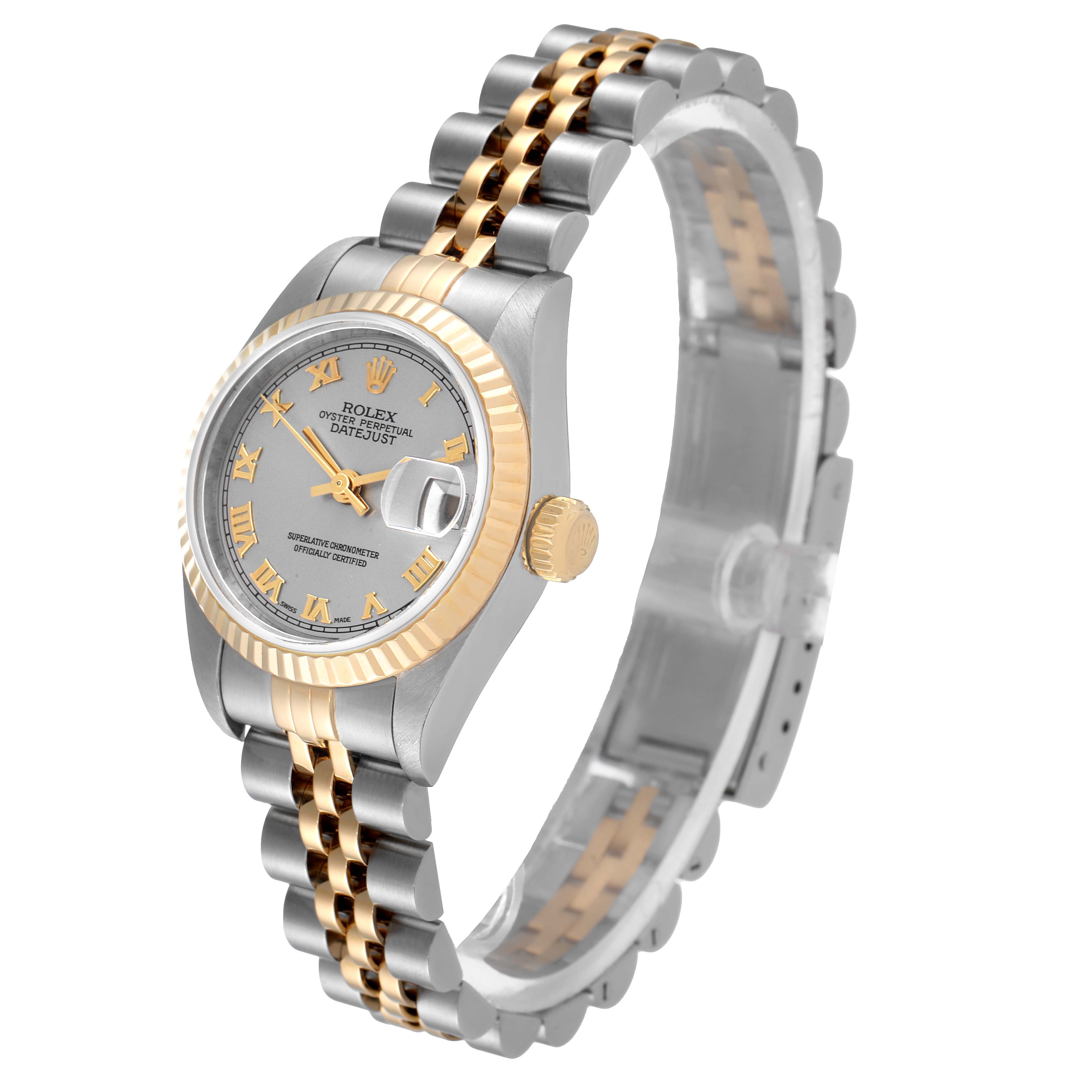 The image shows a side angle of a Rolex Datejust 79173 Women's Stainless Steel Grey Dial 79173 Women's Stainless Steel Grey Dial watch, featuring a two-tone bracelet, silver dial, and gold fluted bezel.