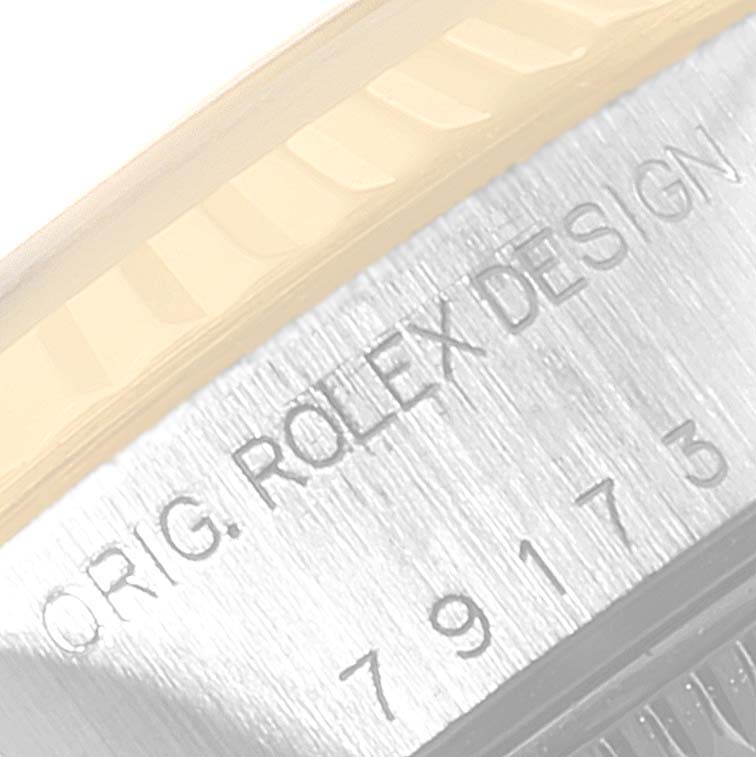 The image shows a close-up view of the serial number engraving on the case of a Rolex Datejust 79173 Women's Stainless Steel Grey Dial 79173 Women's Stainless Steel Grey Dial watch.