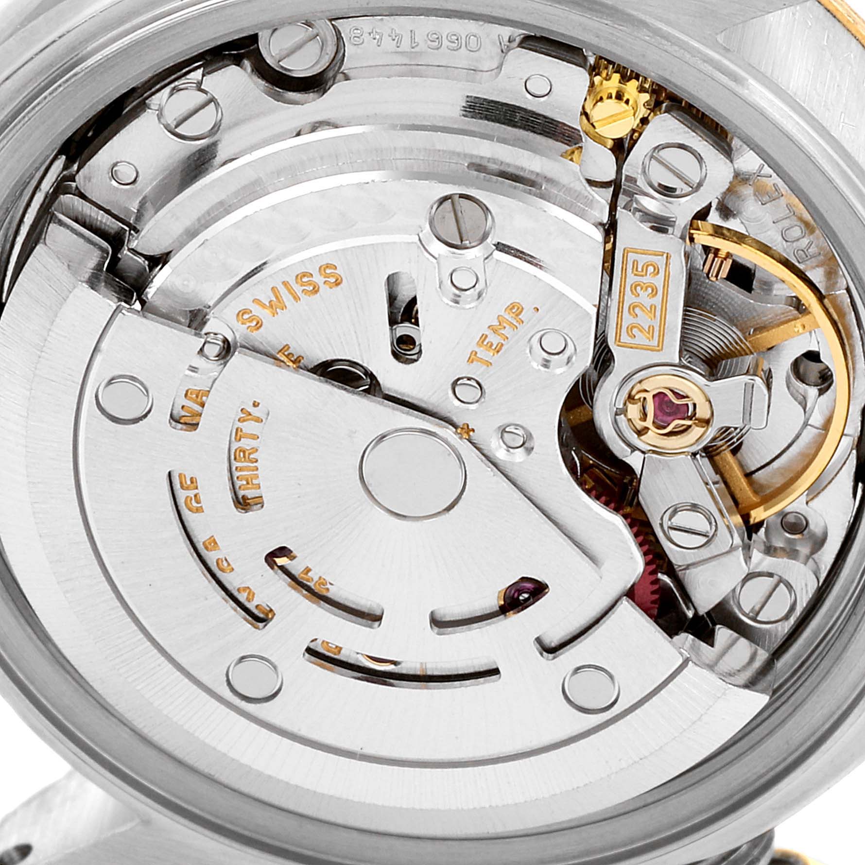 The image shows a close-up of the movement mechanism inside a Rolex Datejust 79173 Women's Stainless Steel Grey Dial 79173 Women's Stainless Steel Grey Dial watch, highlighting gears and intricate components.