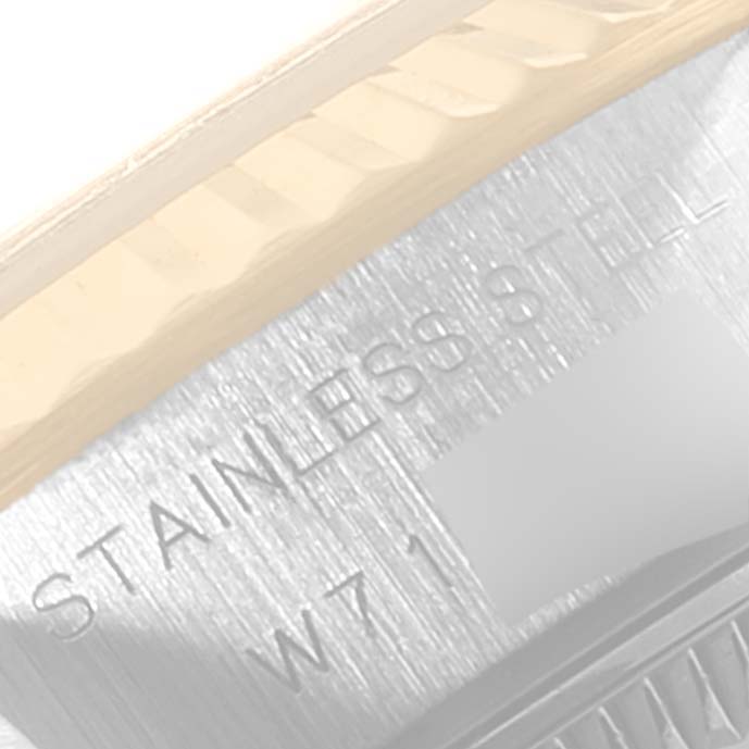 The image shows a close-up angle of the back and outer edge of the Rolex Datejust 69173 Women's Steel and Gold (two tone) White Dial 69173 Women's Steel and Gold (two tone) White Dial watch case, with "STAINLESS STEEL" engraved.