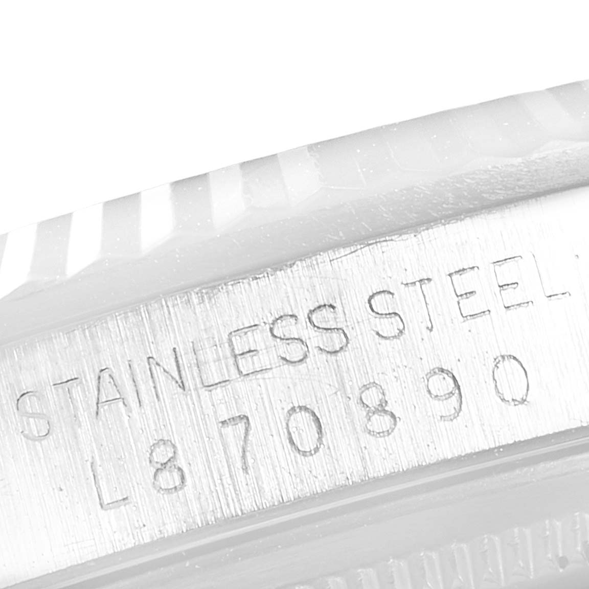 The image shows a close-up of the stainless steel case with the serial number of a Rolex Datejust 16234 Men's Stainless Steel Silver Dial 16234 Men's Stainless Steel Silver Dial watch.
