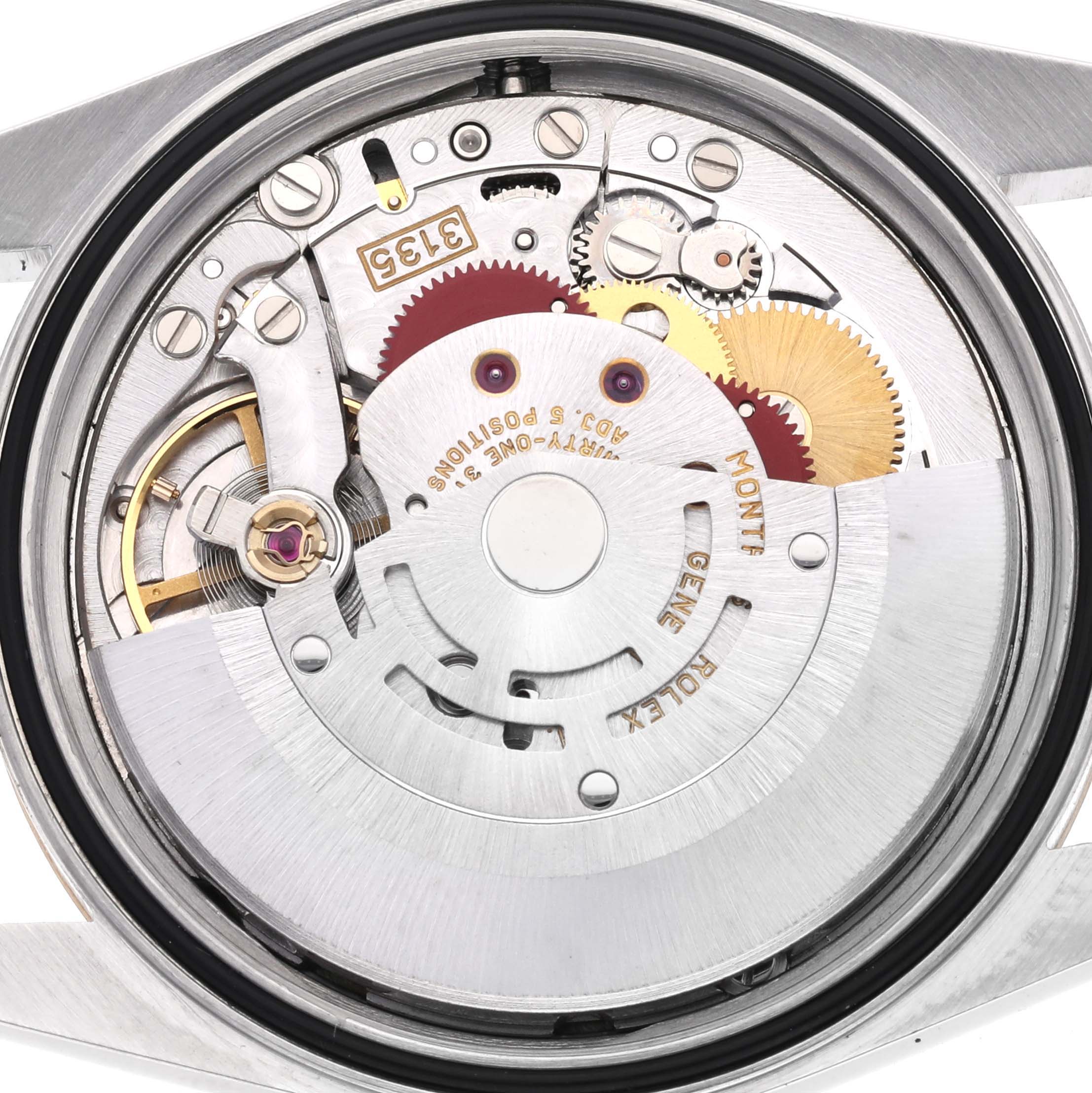 The image shows the internal mechanism of a Rolex Datejust 16233 Men's Steel and Gold (two tone) Champagne Dial 16233 Men's Steel and Gold (two tone) Champagne Dial, focusing on gears and components from a top-down angle.