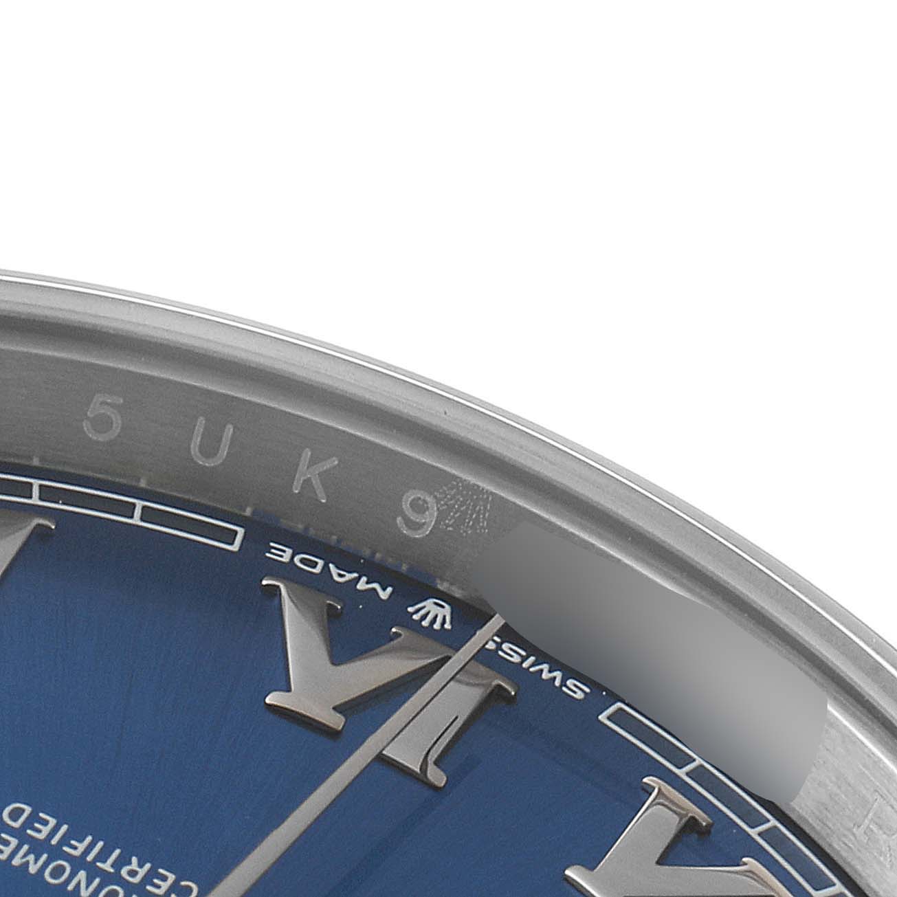 The image shows a close-up of the dial and rehaut of a Rolex Datejust 41 126300 Men
s Stainless Steel Blue Dial 126300 Men
s Stainless Steel Blue Dial watch, focused on the Roman numerals and inscription.