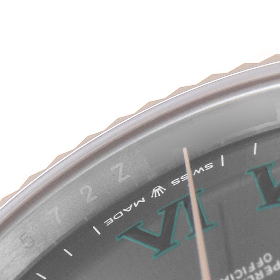 The image shows a close-up angle of the Rolex Datejust 41 126331 Men's Steel and Gold (two tone) Grey Dial 126331 Men's Steel and Gold (two tone) Grey Dial's dial and part of the fluted bezel.