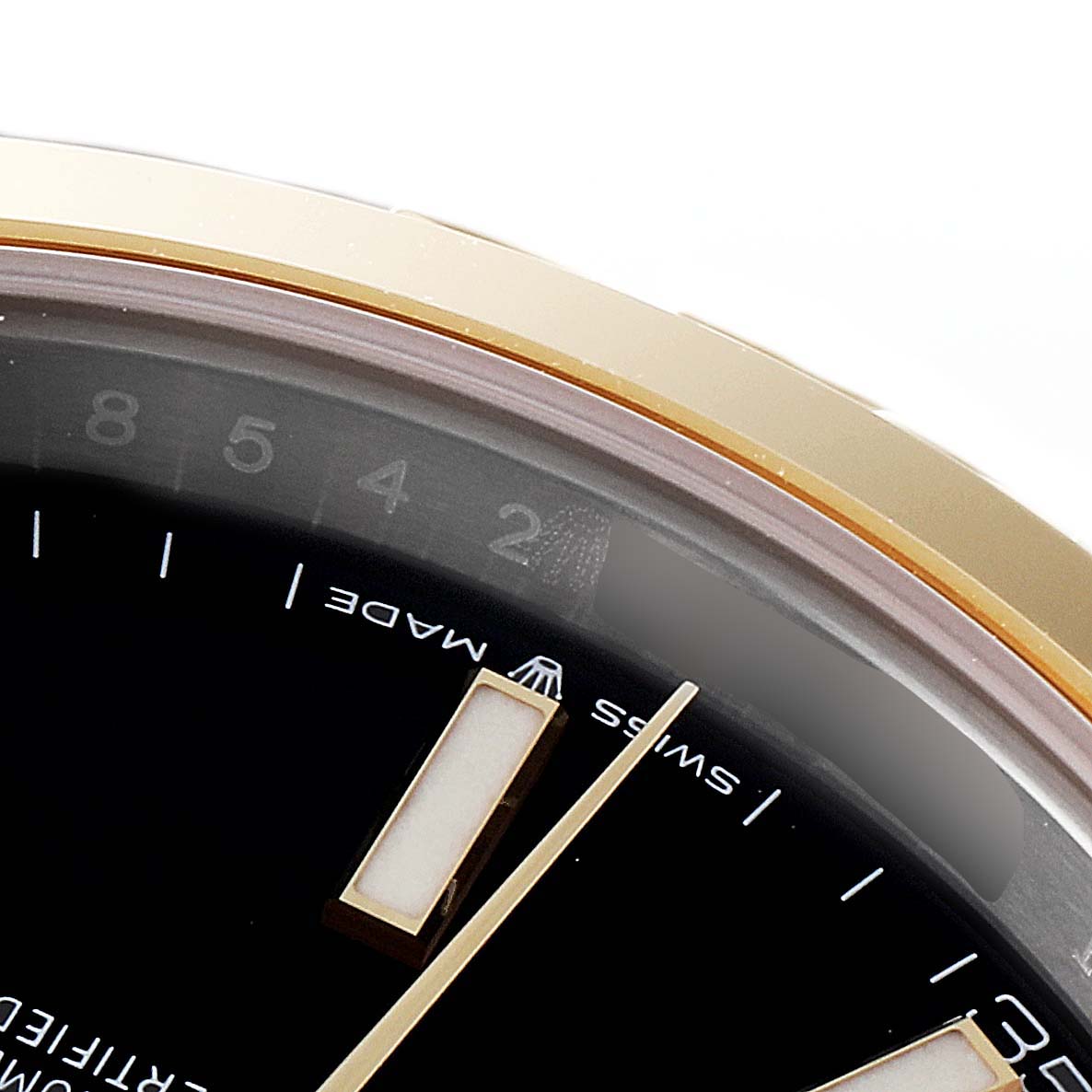 The image shows a close-up angle of the Rolex Datejust 41 126303 Men's Steel and Gold (two tone) Black Dial 126303 Men's Steel and Gold (two tone) Black Dial model, displaying part of the dial, a few hour markers, and the "Swiss Made" text.