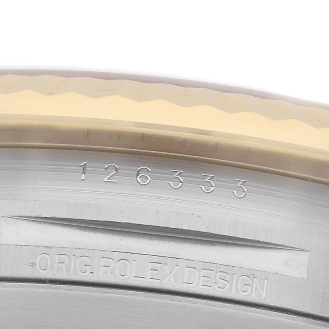 The image shows a close-up of the Rolex Datejust 41 126333 Men's Steel and Gold (two tone) White Dial 126333 Men's Steel and Gold (two tone) White Dial model, focusing on the engraved serial number and "ORIG. ROLEX DESIGN" text.