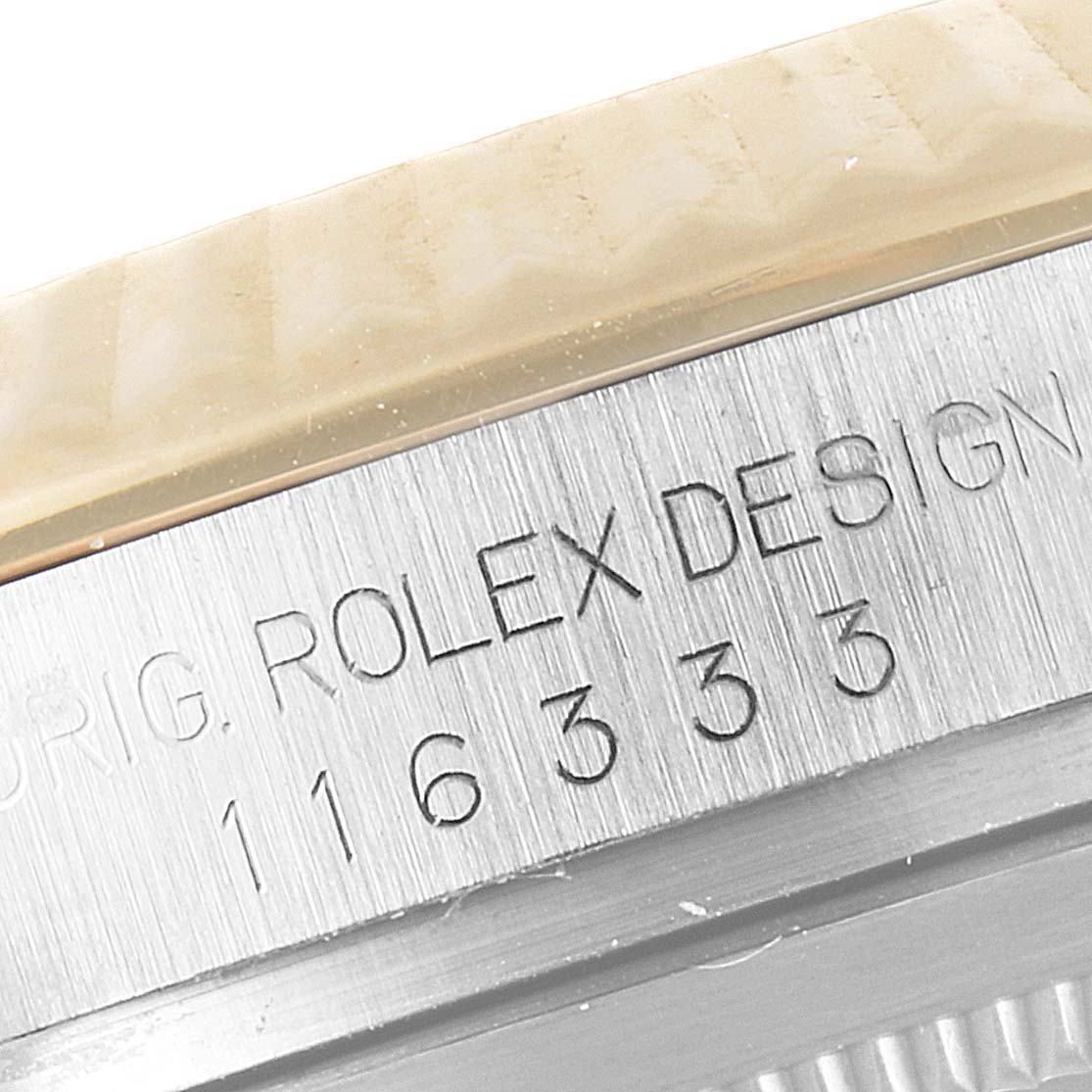 This close-up image shows the engraved serial number on the side of a Rolex Datejust 41 116333 Men's Steel and Gold (two tone) Black Dial 116333 Men's Steel and Gold (two tone) Black Dial watch.