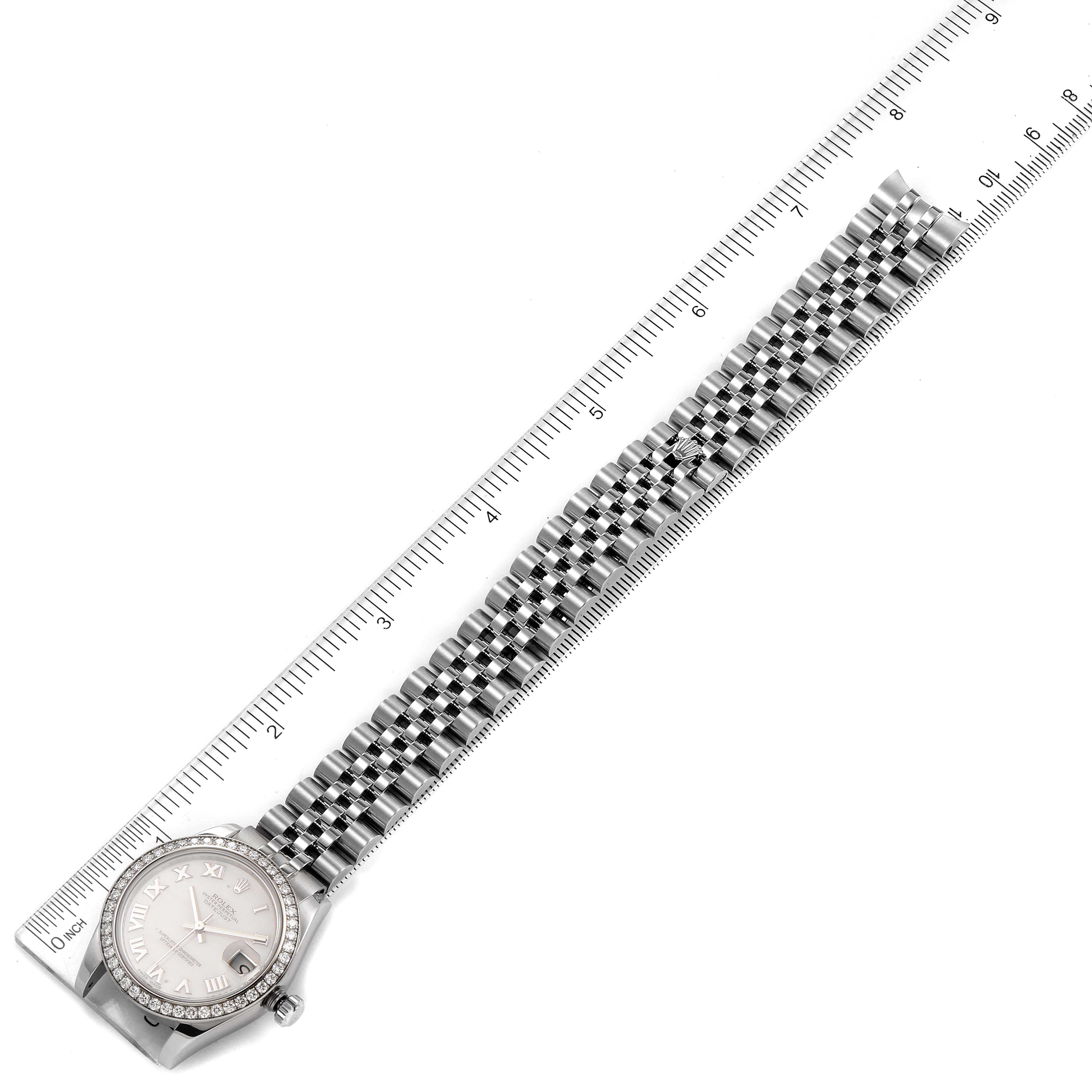 The image shows a complete Rolex Mid-Size 178384 Women's Stainless Steel Mother of Pearl Dial 178384 Women's Stainless Steel Mother of Pearl Dial watch placed next to a ruler, displaying its full length and bracelet details.