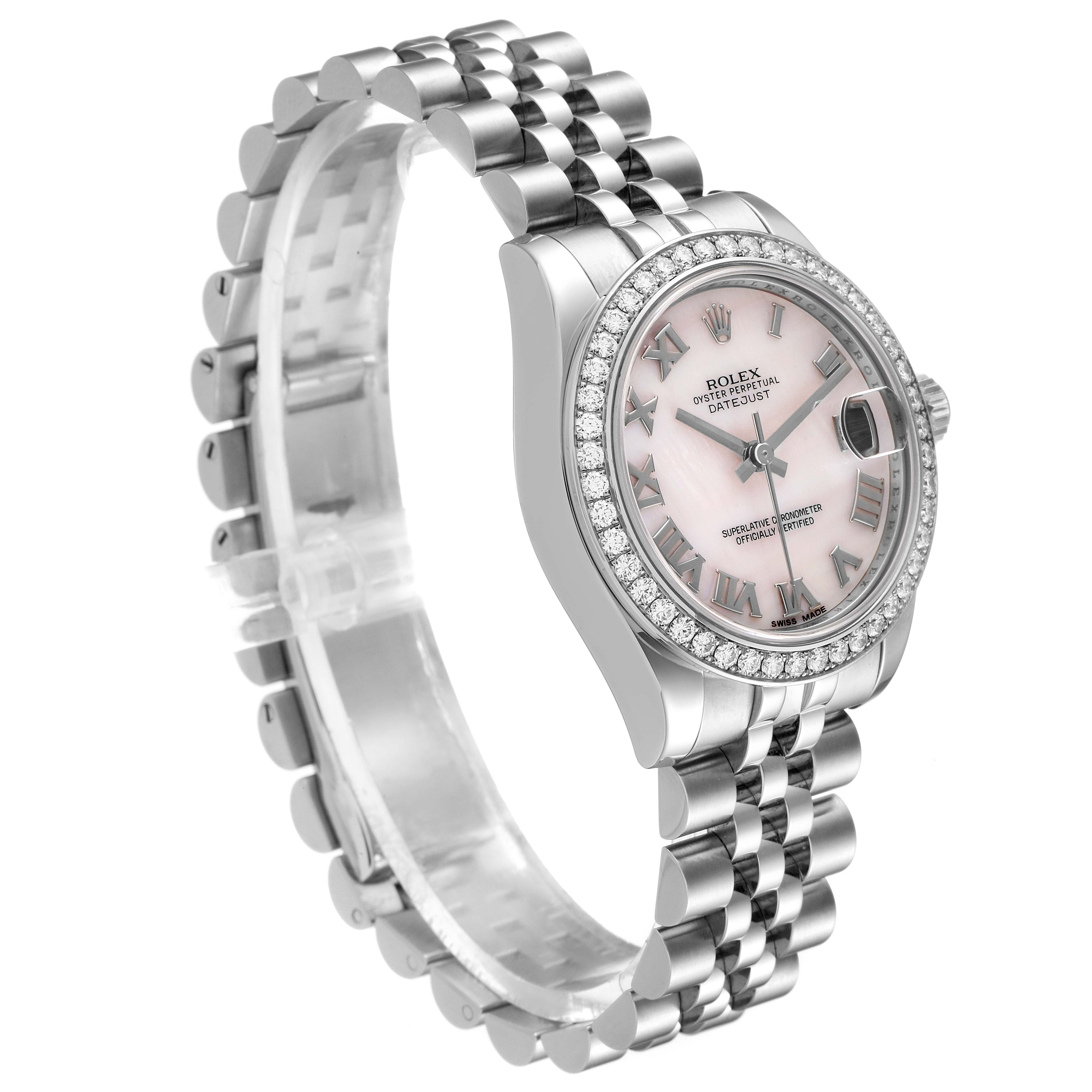 The image shows a Rolex Mid-Size 178384 Women's Stainless Steel Mother of Pearl Dial 178384 Women's Stainless Steel Mother of Pearl Dial Datejust watch, showcasing its pink dial, diamond-encrusted bezel, and stainless steel bracelet from an angled perspective.