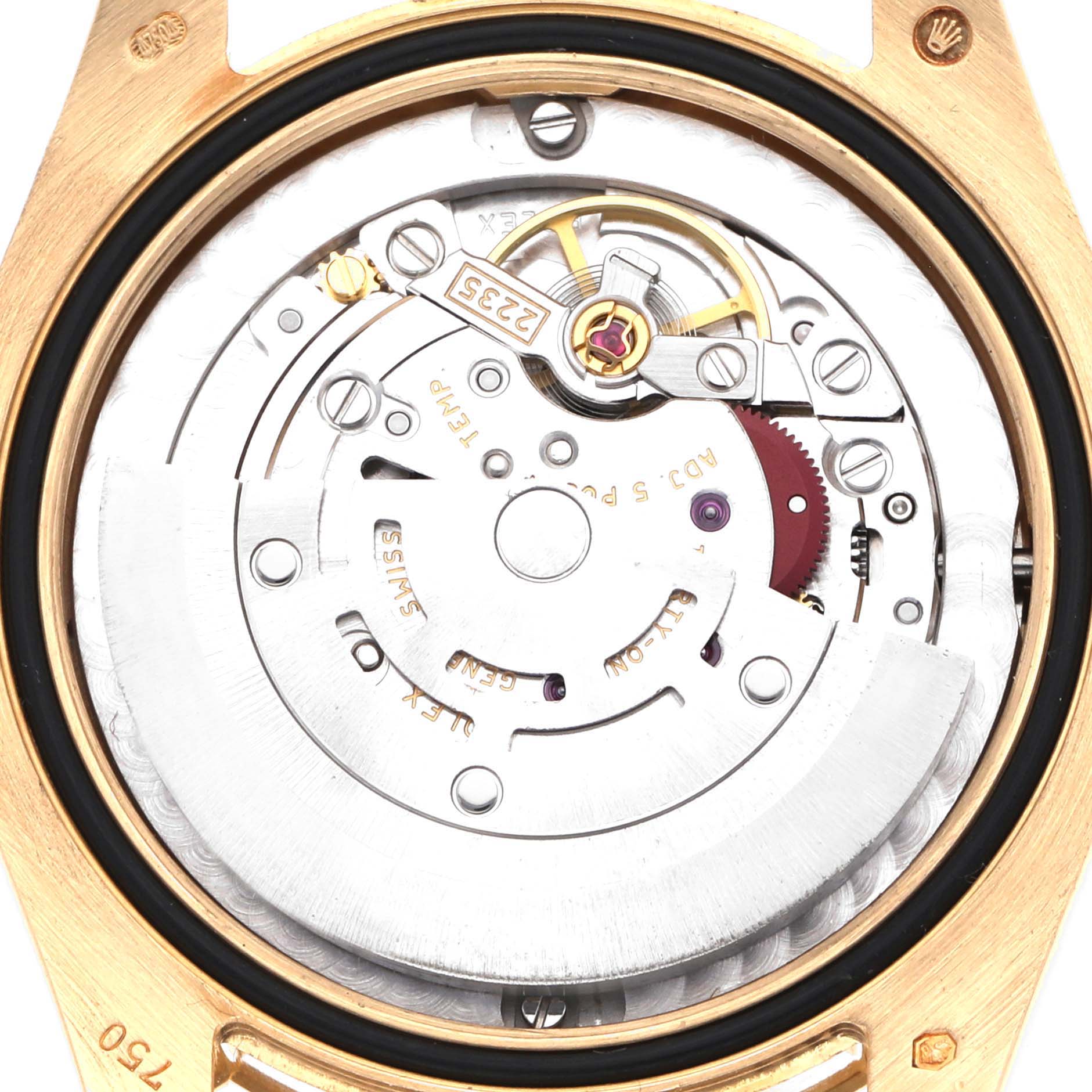 The Rolex Mid-Size model watch is shown from the back, displaying its intricate movement and rotor mechanism.
