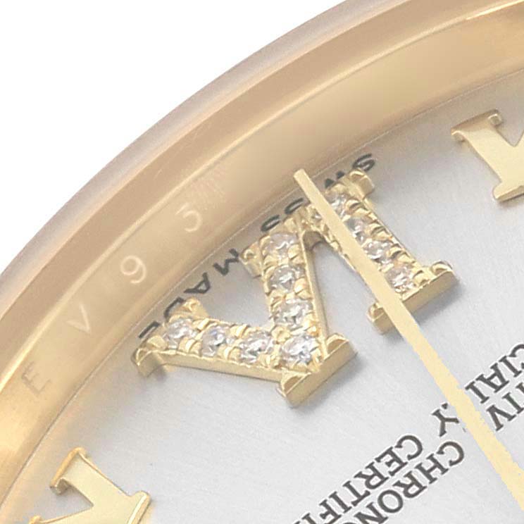 The image shows a close-up of a Rolex Mid-Size watch focusing on a jeweled Roman numeral marker and part of the bezel.