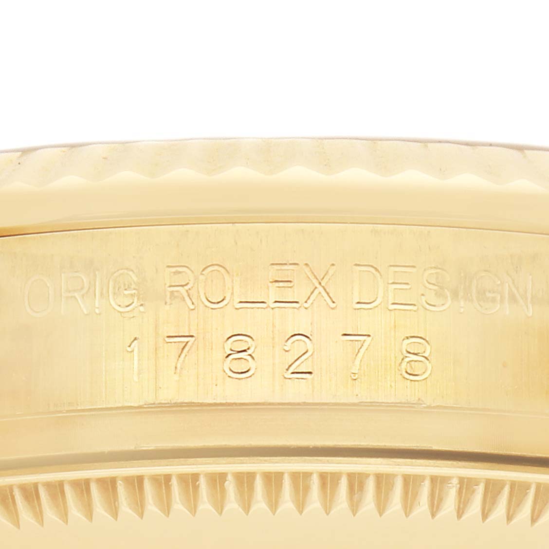 The image shows a side view of a Rolex Mid-Size model, highlighting the engraved bezel and reference number.