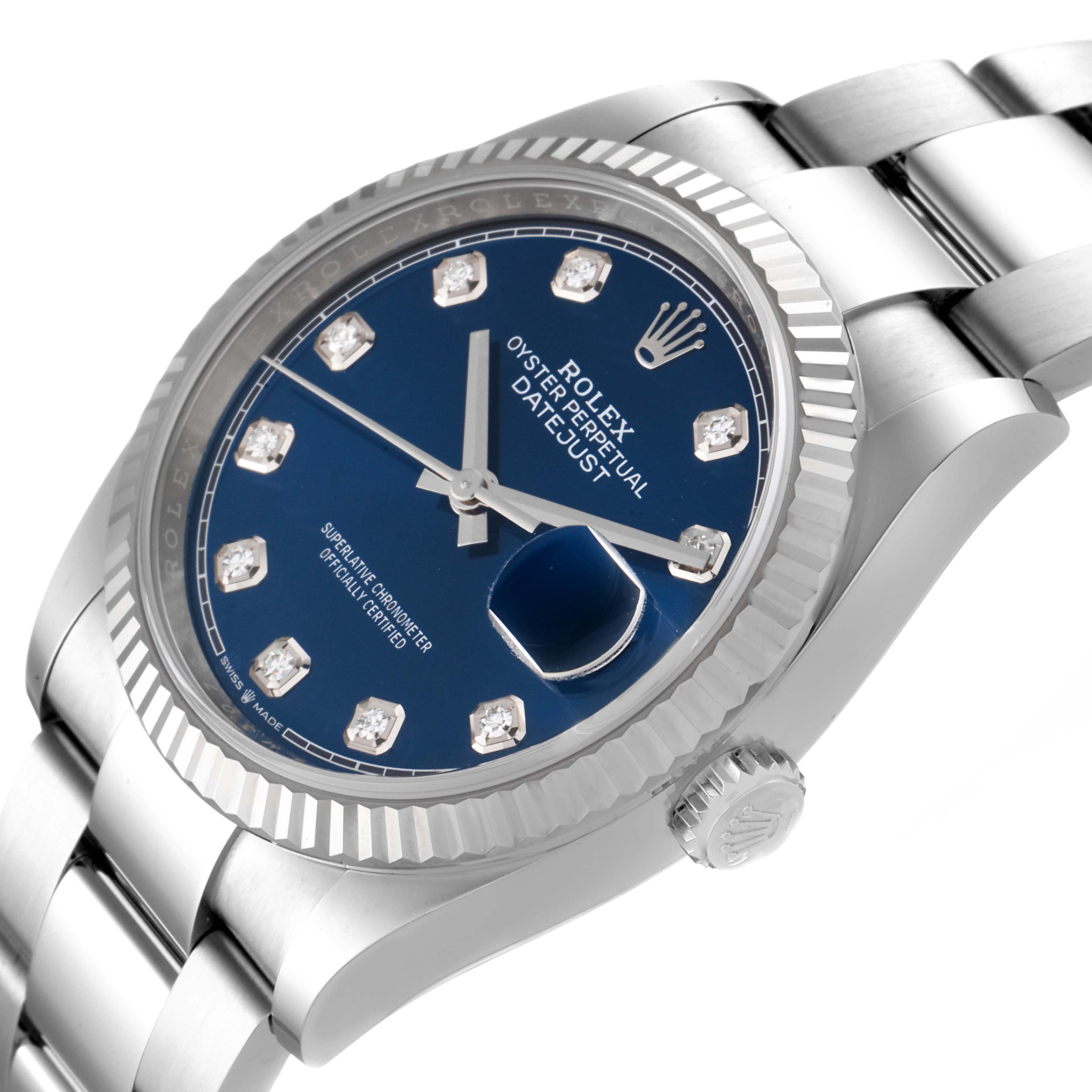 The image shows a side angle of a Rolex Datejust 126234 Men's Stainless Steel Blue Dial 126234 Men's Stainless Steel Blue Dial watch, highlighting the blue dial, fluted bezel, date window, and part of the bracelet.