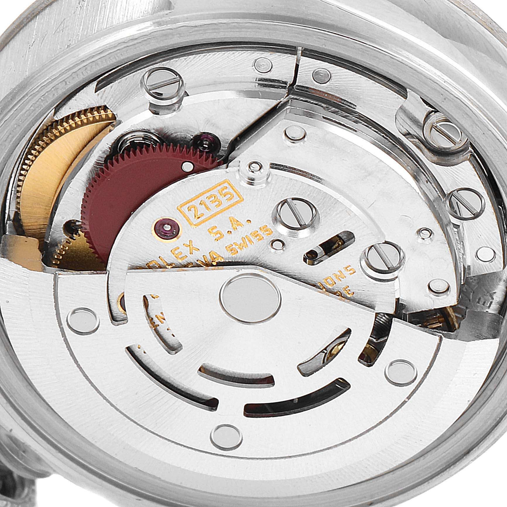 This is a close-up shot of the movement mechanism inside a Rolex Datejust 69174 Women
s Stainless Steel Silver Dial 69174 Women
s Stainless Steel Silver Dial watch, showcasing its intricate components.