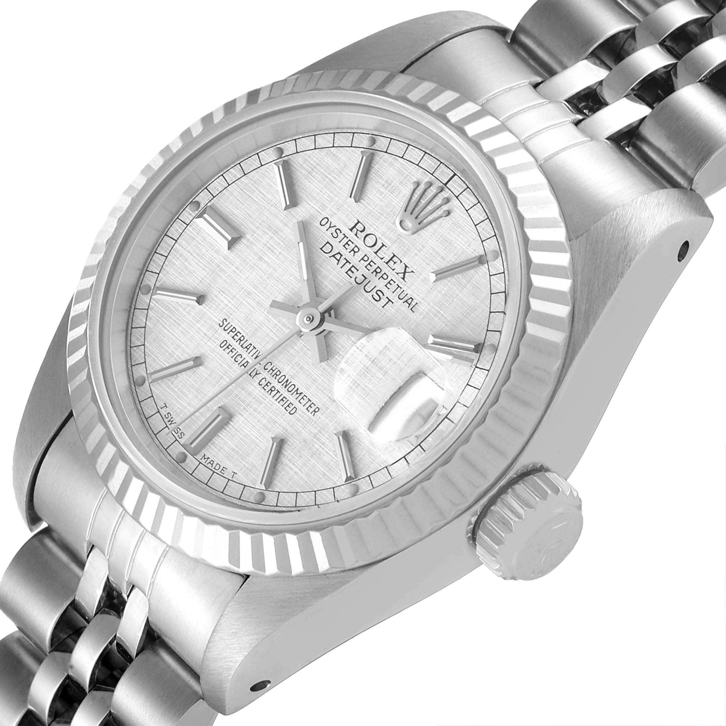 The image shows a close-up angle of a Rolex Datejust 69174 Women
s Stainless Steel Silver Dial 69174 Women
s Stainless Steel Silver Dial watch focusing on the face, bezel, and part of the bracelet.