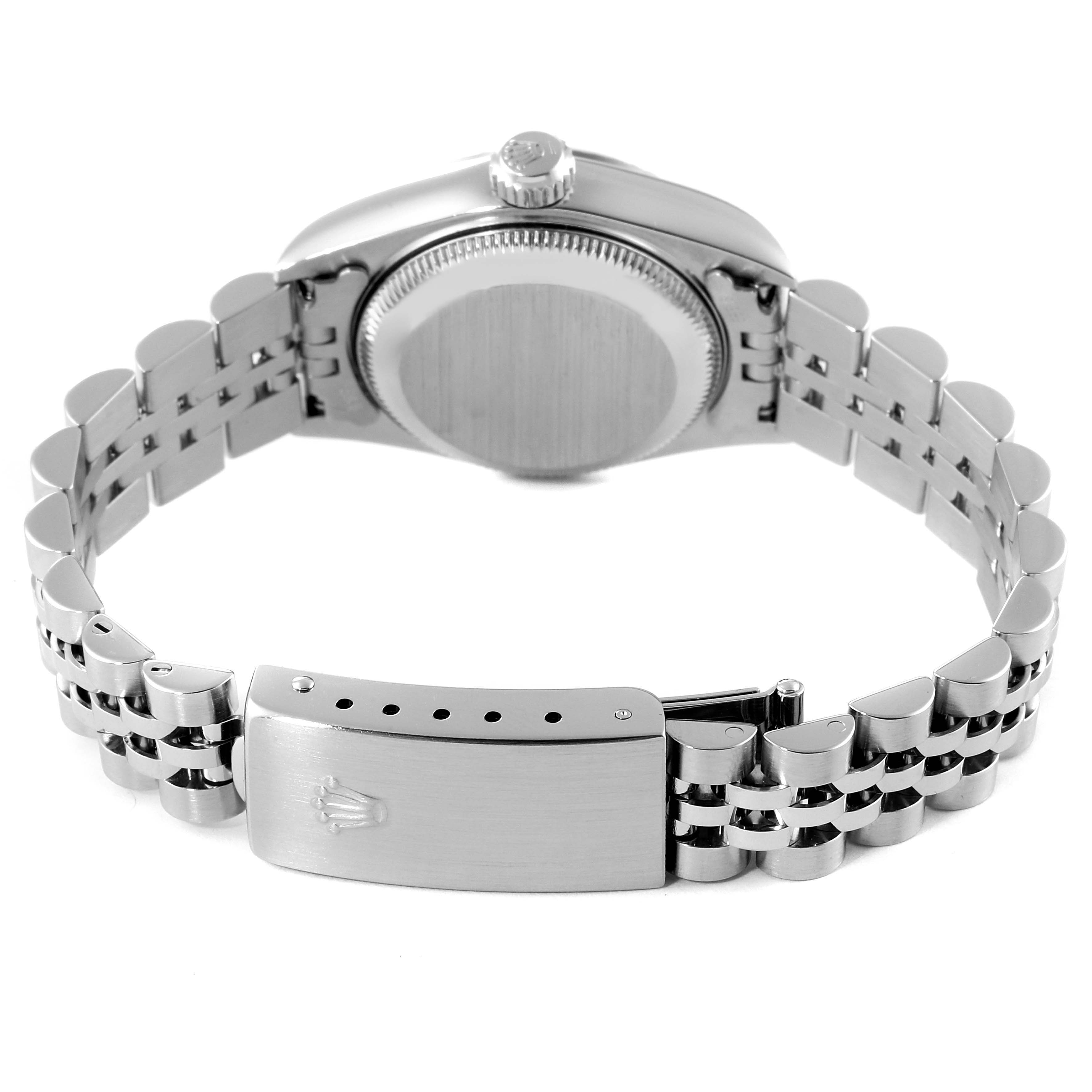 The image shows the backside of the Rolex Datejust 79174 Women's Stainless Steel Blue Dial 79174 Women's Stainless Steel Blue Dial watch focusing on the case back, crown, and bracelet clasp.