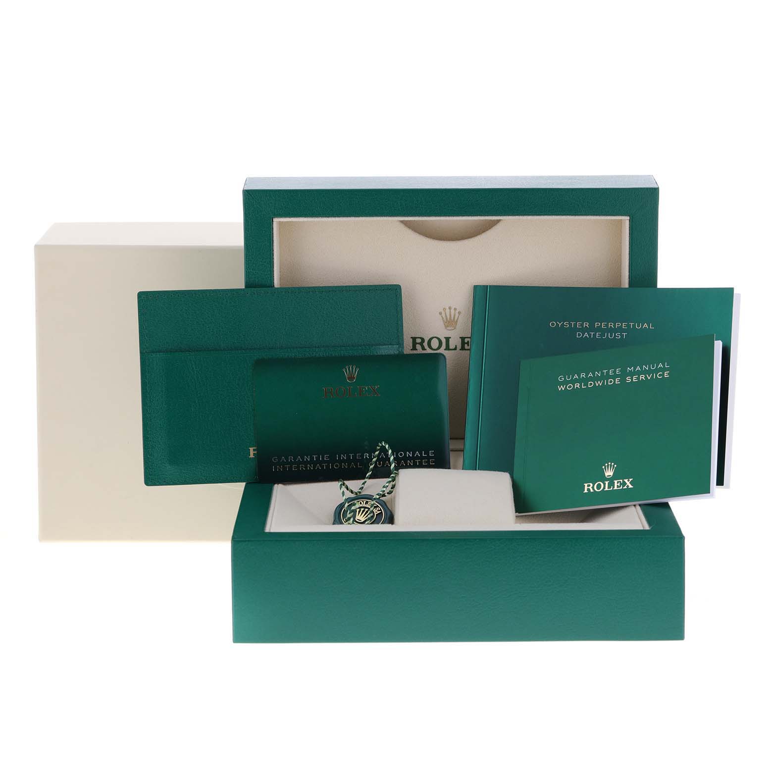 This image shows the packaging and accessories for a Rolex Datejust 126234 Men's Stainless Steel White Dial 126234 Men's Stainless Steel White Dial watch, including a box, manuals, warranty card, and tag.