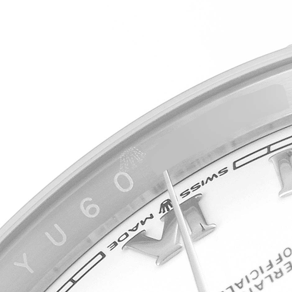 This close-up shot of the Rolex Datejust 126234 Men's Stainless Steel White Dial 126234 Men's Stainless Steel White Dial watch highlights part of the dial, the "Swiss Made" text, and the edge of the crystal with the Rolex logo.