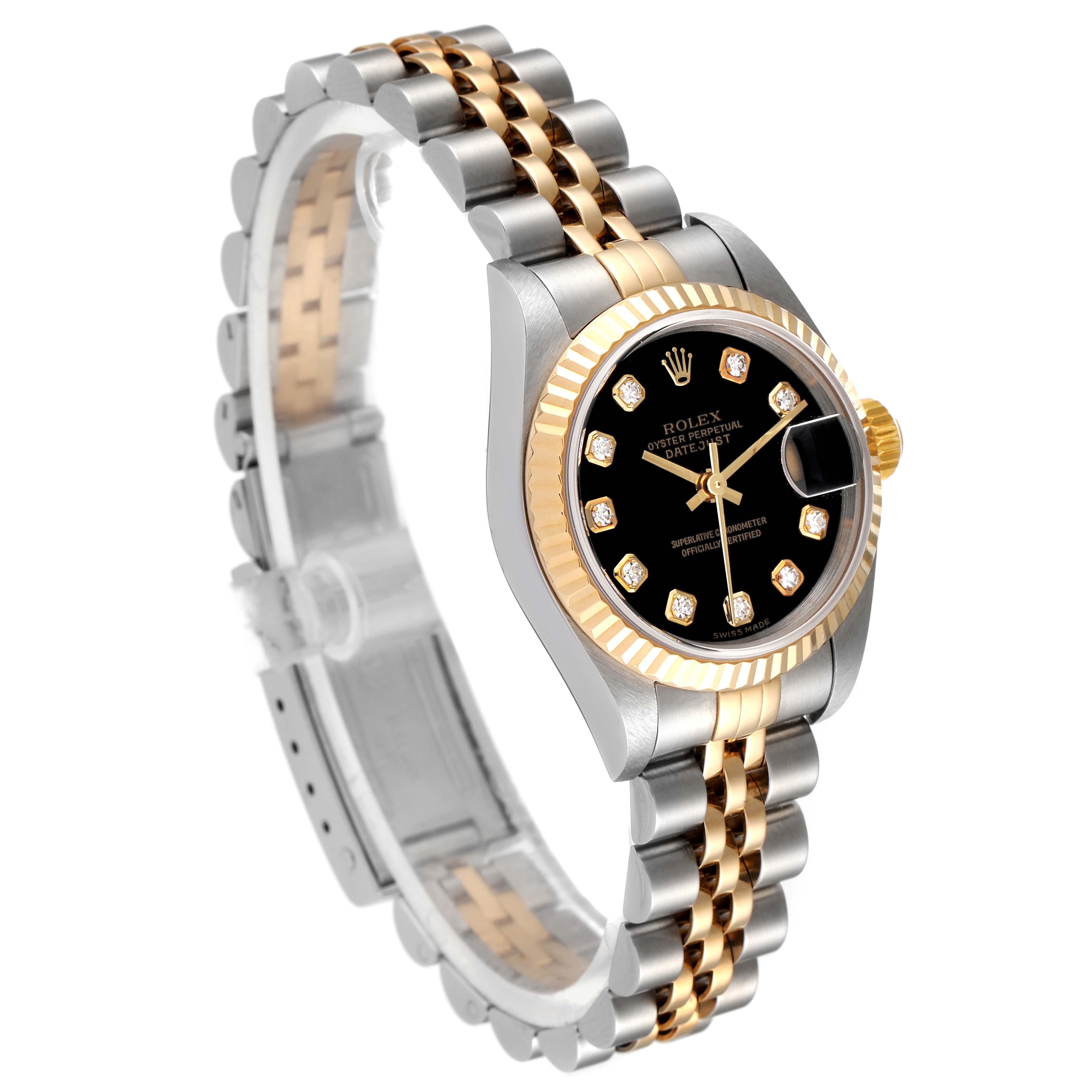 The image shows a Rolex Datejust 79173 Women's Steel and Gold (two tone) Black Dial 79173 Women's Steel and Gold (two tone) Black Dial with a two-tone bracelet and a black dial featuring diamond hour markers.
