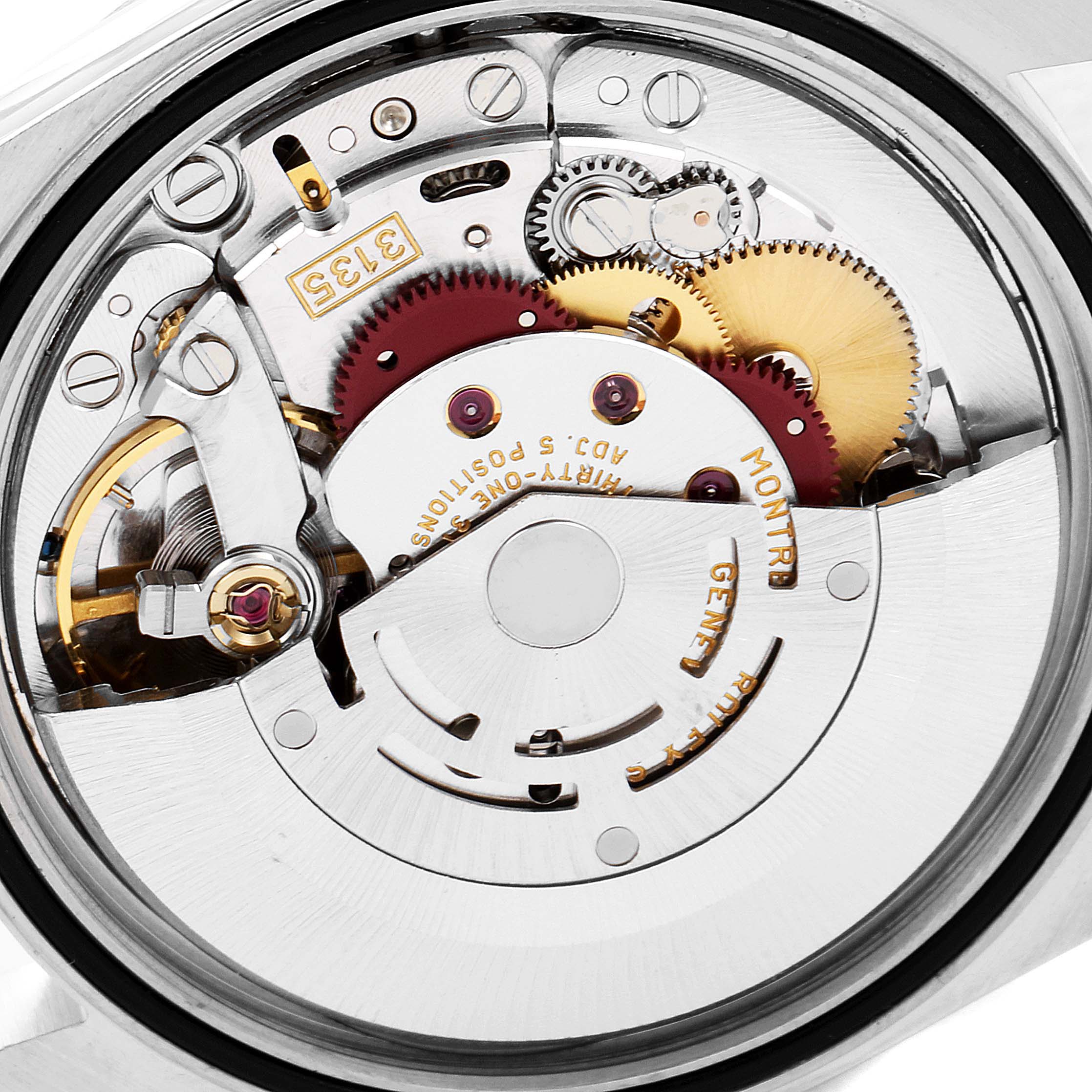 This is an open view of the Rolex Datejust 16233 Men's Steel and Gold (two tone) Champagne Dial 16233 Men's Steel and Gold (two tone) Champagne Dial watch movement, showcasing its intricate gears and inner mechanisms.