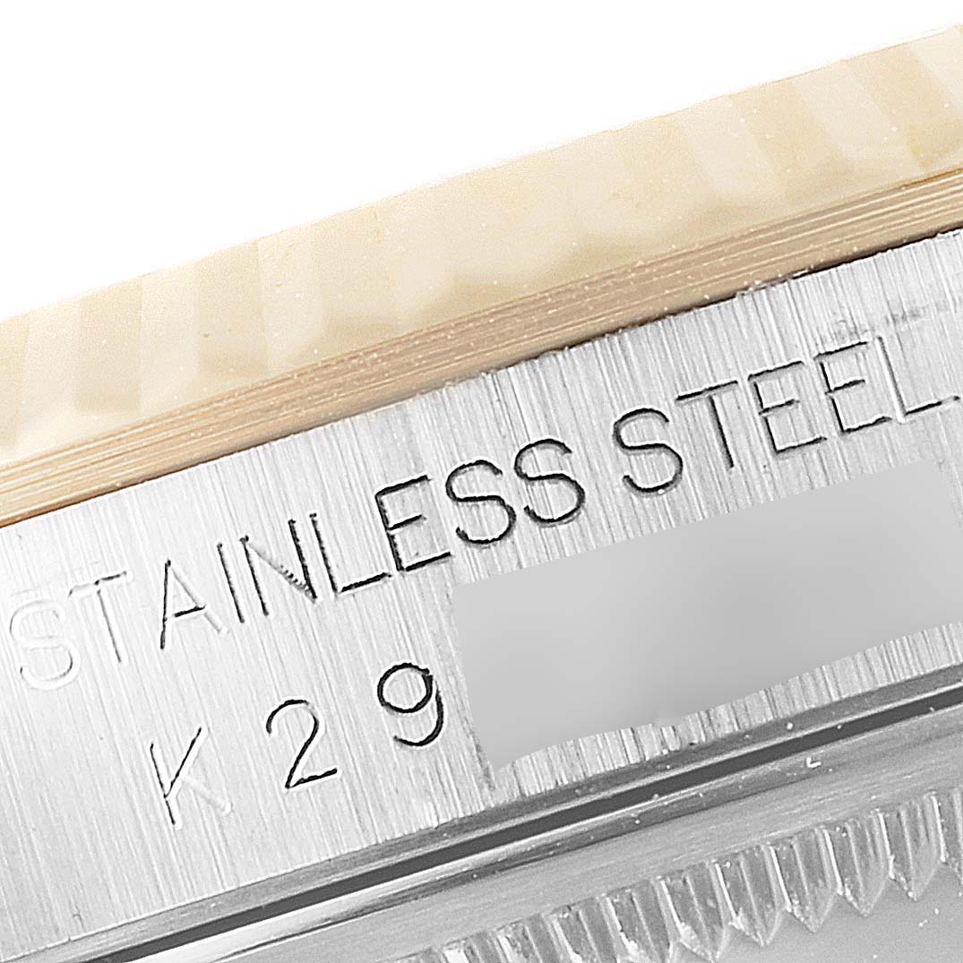 This close-up image showcases the stainless steel casing and bezel of a Rolex Datejust 16233 Men's Steel and Gold (two tone) Champagne Dial 16233 Men's Steel and Gold (two tone) Champagne Dial watch.