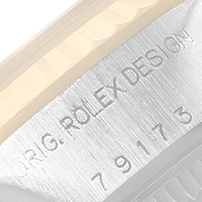 The image shows a close-up of the side engraving on a Rolex Datejust 79173 Women's Steel and Gold (two tone) Mother of Pearl Dial 79173 Women's Steel and Gold (two tone) Mother of Pearl Dial watch, highlighting the model number and branding.