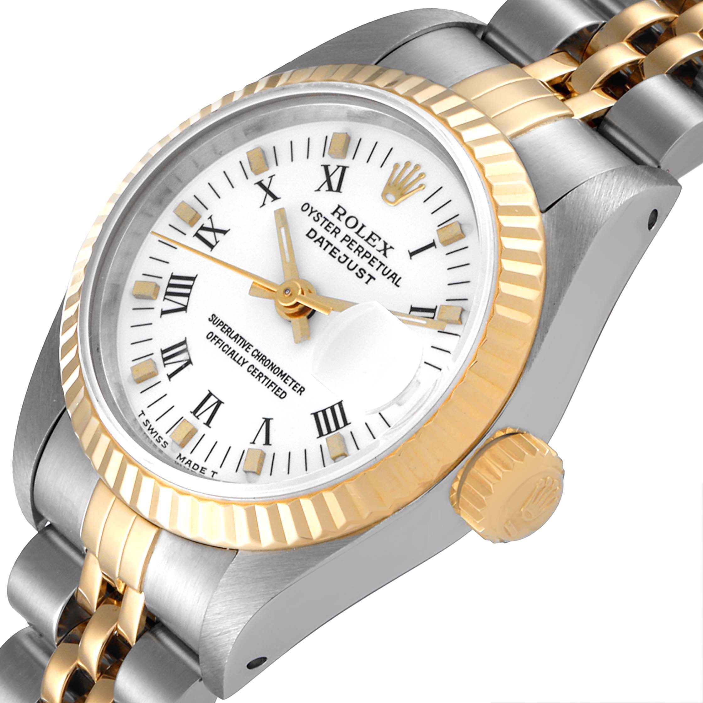 The Rolex Datejust 69173 Women
s Steel and Gold (two tone) White Dial 69173 Women
s Steel and Gold (two tone) White Dial watch is shown at a tilted angle, highlighting its face, bezel, crown, and part of its bracelet.