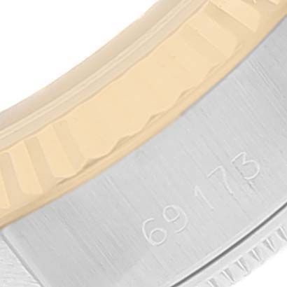 The image shows a close-up of the bezel and part of the casing near the serial number 69173 on a Rolex Datejust 69173 Women
s Steel and Gold (two tone) White Dial 69173 Women
s Steel and Gold (two tone) White Dial watch.