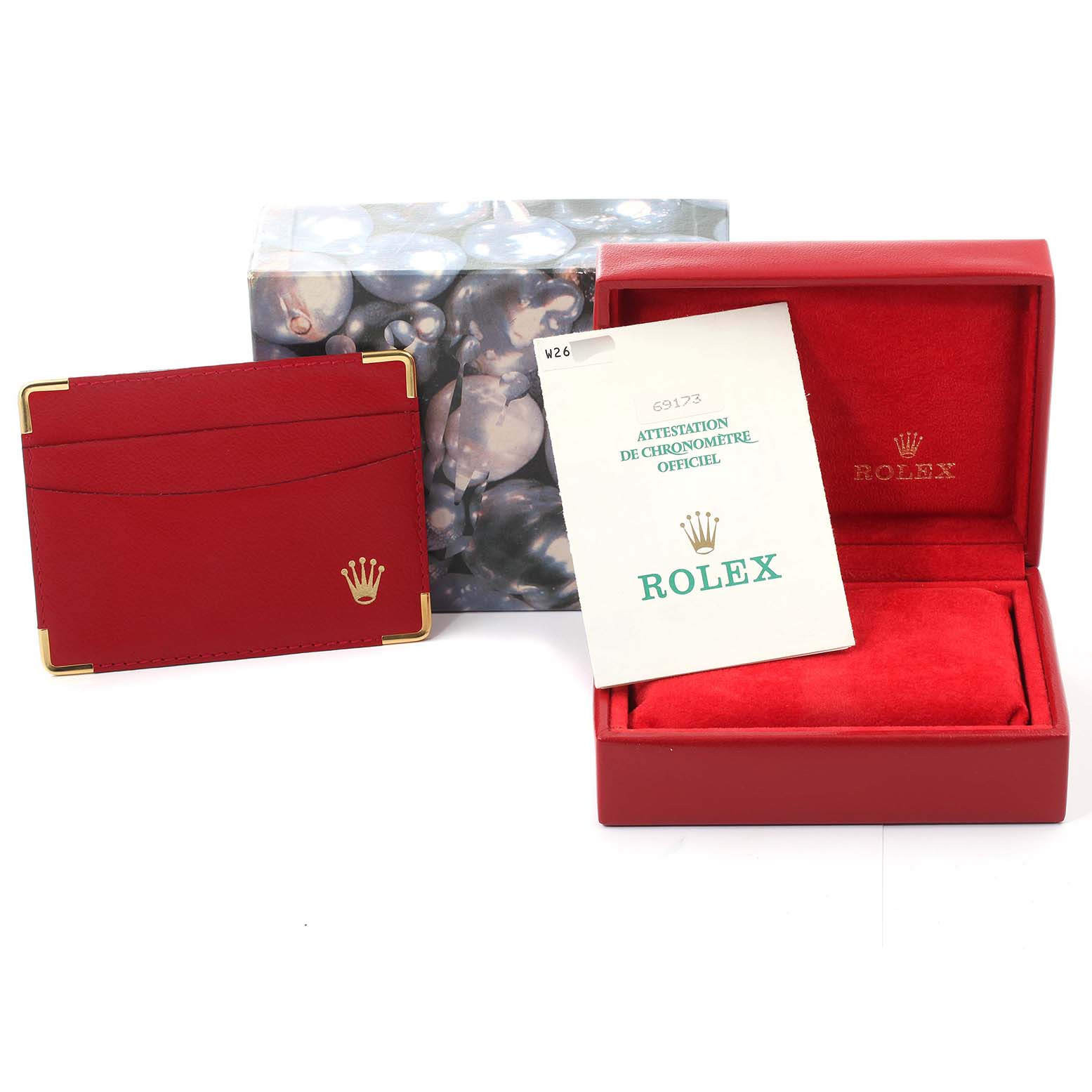 This image shows the packaging and accessories for a Rolex Datejust 69173 Women's Steel and Gold (two tone) White Dial 69173 Women's Steel and Gold (two tone) White Dial watch, including a box, a cardholder, and a certificate.