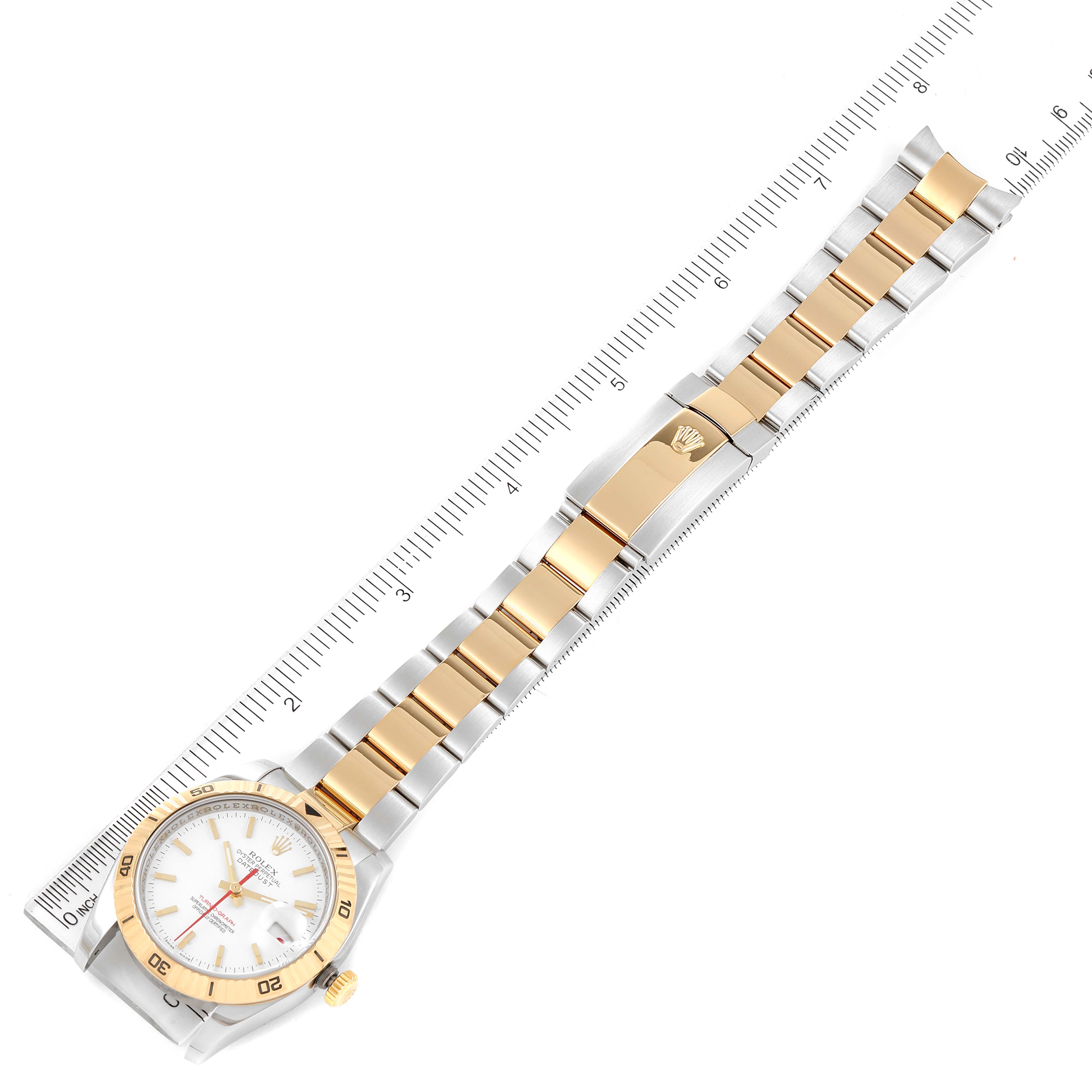 The image shows a top-down view of a Rolex Turn-o-Graph 43821 Men's Steel and Gold (two tone) White Dial 43821 Men's Steel and Gold (two tone) White Dial watch, highlighting the bracelet and clasp against a measurement ruler.