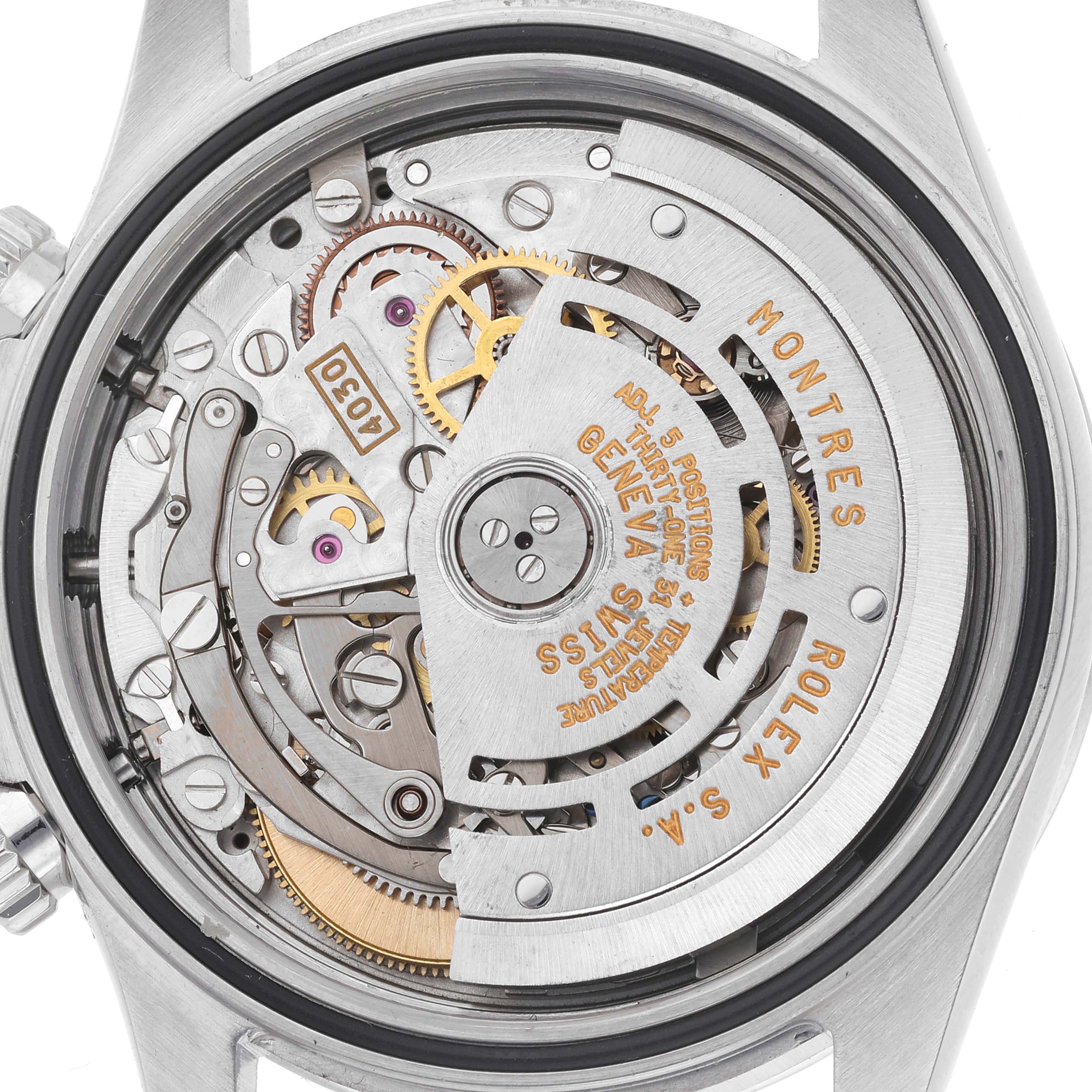 The image shows the movement of a Rolex Daytona 16520 Men
s Stainless Steel White Dial 16520 Men
s Stainless Steel White Dial watch from a straight-on angle, displaying gears and engravings.