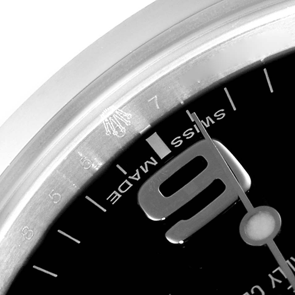 This image shows a close-up of the face, bezel, and numeral dial of a Rolex Explorer 214270 Men's Stainless Steel Black Dial 214270 Men's Stainless Steel Black Dial watch.