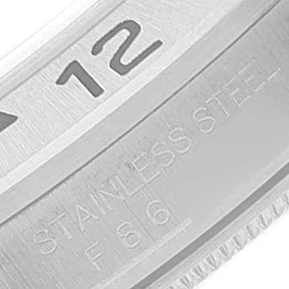This close-up image shows a portion of the bezel and engraving on a Rolex Explorer 16570 Men's Stainless Steel Black Dial 16570 Men's Stainless Steel Black Dial watch.