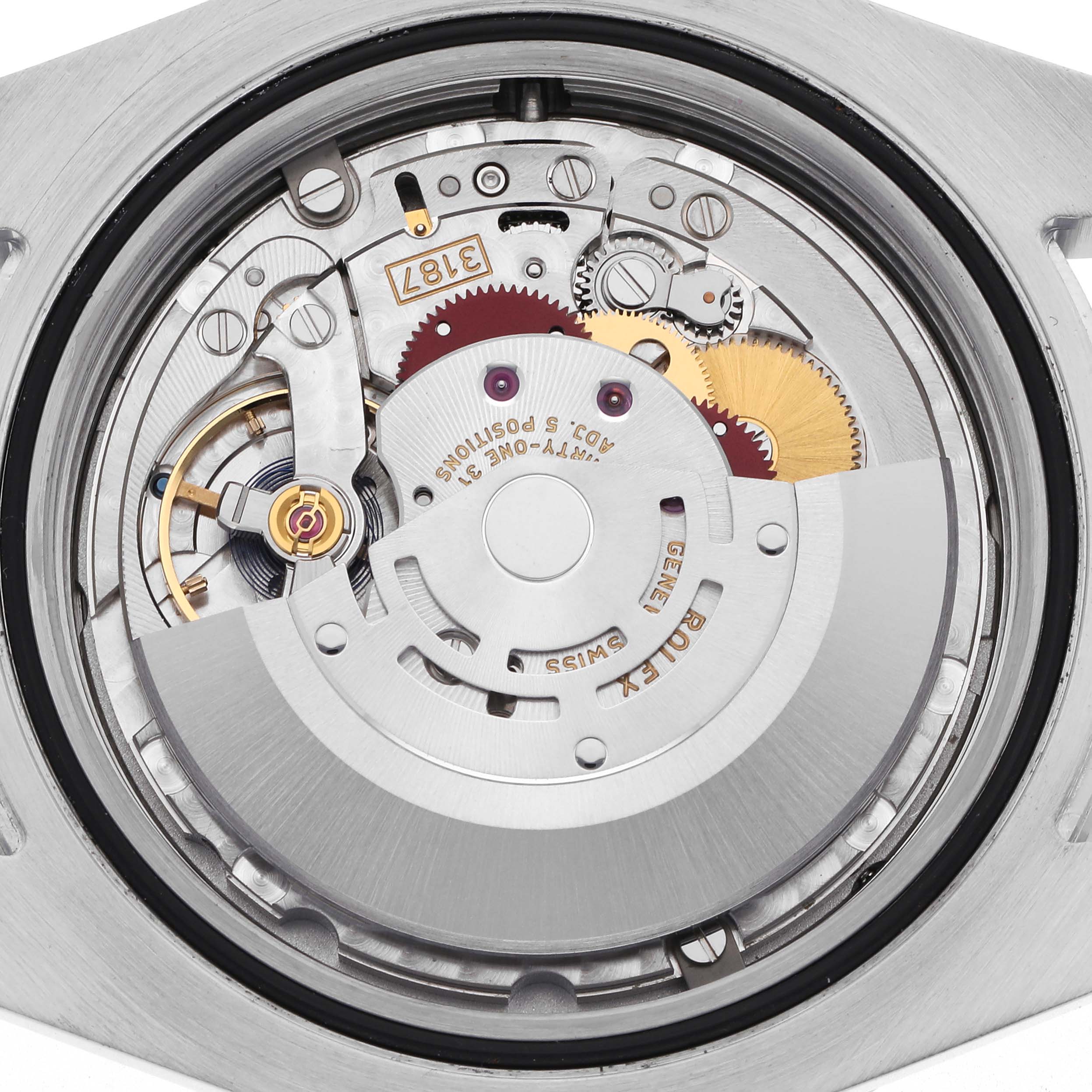 The image shows the movement of a Rolex Explorer 216570 Men's Stainless Steel White Dial 216570 Men's Stainless Steel White Dial watch, highlighting the intricate internal components from a top-down angle.