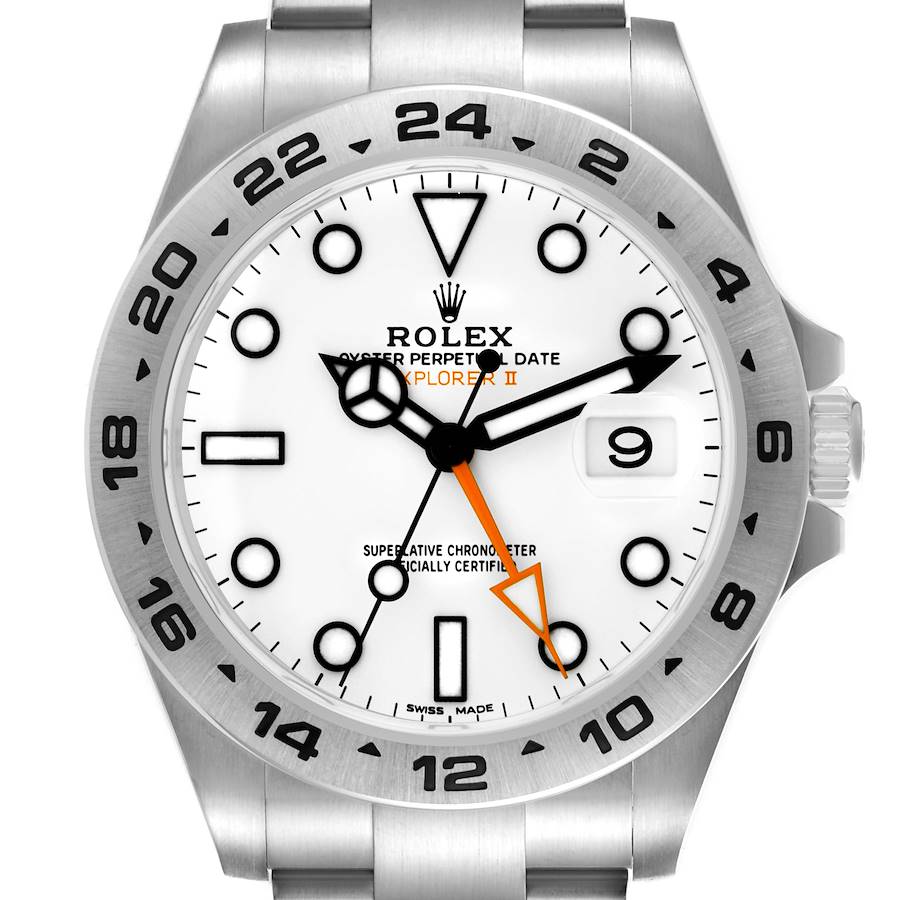The Rolex Explorer II watch is shown from a front angle, highlighting the bezel, hands, markers, and crown.