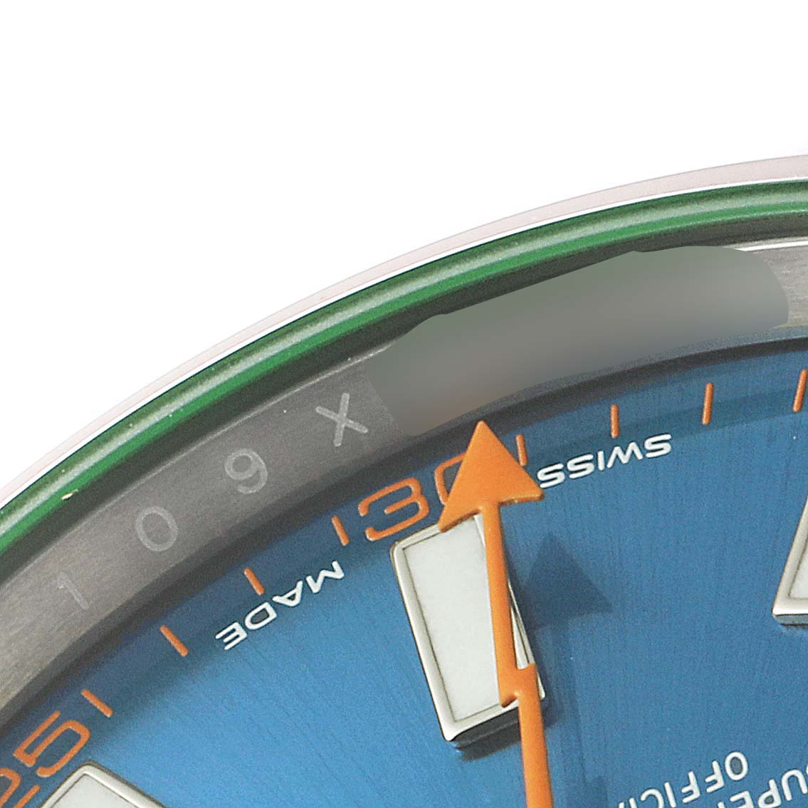 This image shows a close-up of the dial of a Rolex Milgauss 116400GV Men
s Stainless Steel Blue Dial 116400GV Men
s Stainless Steel Blue Dial watch, focusing on the 9 o
clock marker and the orange lightning bolt-shaped second hand.