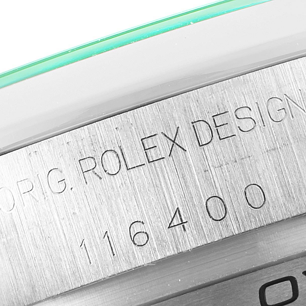 The image shows a close-up of the side engraving on a Rolex Milgauss 116400GV Men
s Stainless Steel Blue Dial 116400GV Men
s Stainless Steel Blue Dial watch, displaying the model number "116400."