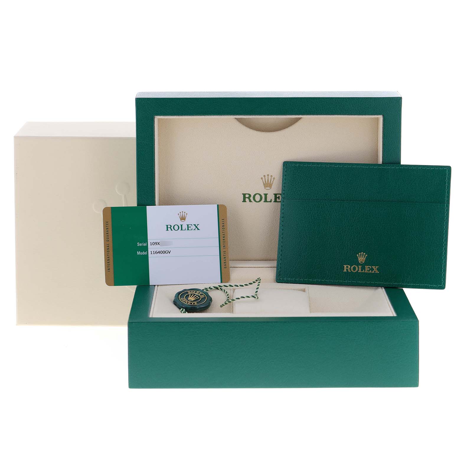 The image shows the accessories for a Rolex Milgauss 116400GV Men
s Stainless Steel Blue Dial 116400GV Men
s Stainless Steel Blue Dial watch, including the box, card, holder, and tags.