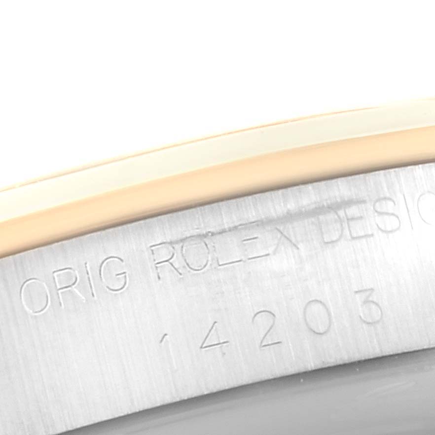 This image shows a close-up of the engraved inner bezel of an Oyster Perpetual model by Rolex.