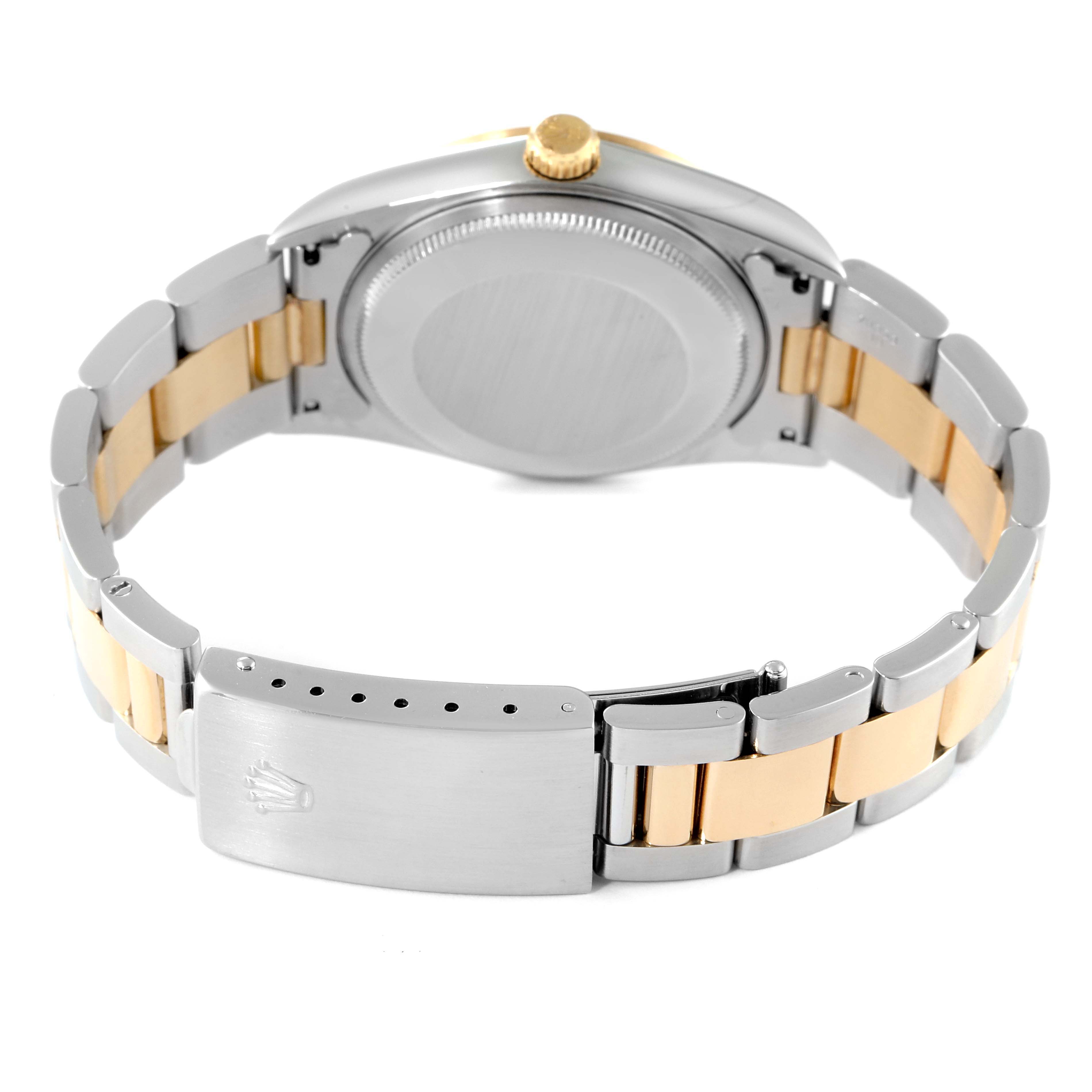 This image shows the back case and bracelet clasp of a Rolex Oyster Perpetual 14203 Men's Steel and Gold (two tone) Grey Dial 14203 Men's Steel and Gold (two tone) Grey Dial watch.