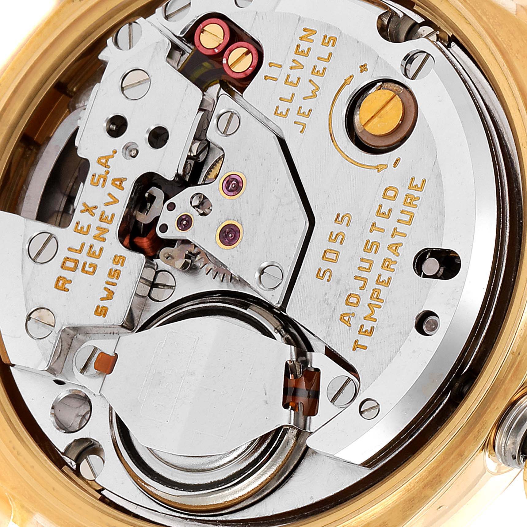 The image shows the inner movement mechanism of the Rolex Oysterquartz 19018 Men's Yellow Gold Champagne Dial 19018 Men's Yellow Gold Champagne Dial model, highlighting the gears and parts.